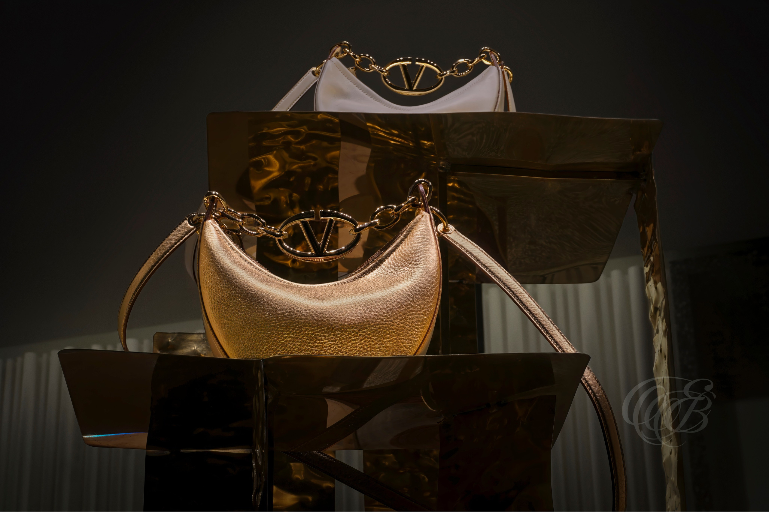 ITALY – ROME – Valentino boutique window display, handbags behind glass viewed through soft interior lighting, photography of Italy, Eduardo Bartoli Photography