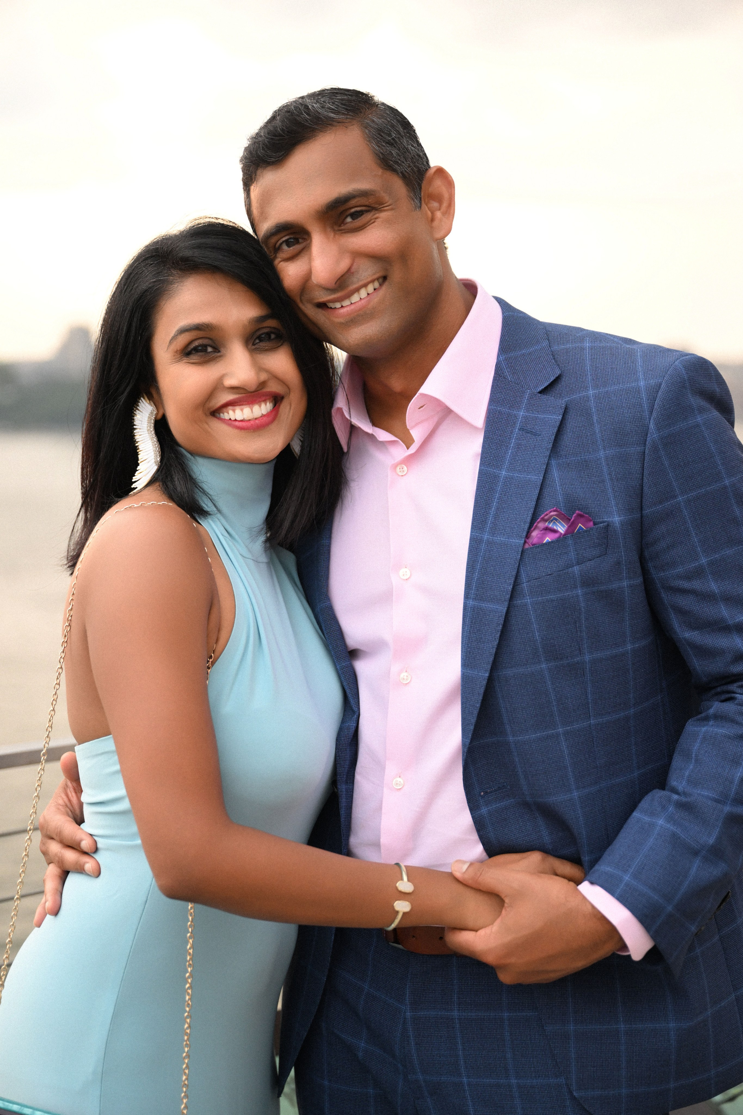 a man and woman are posing for a picture