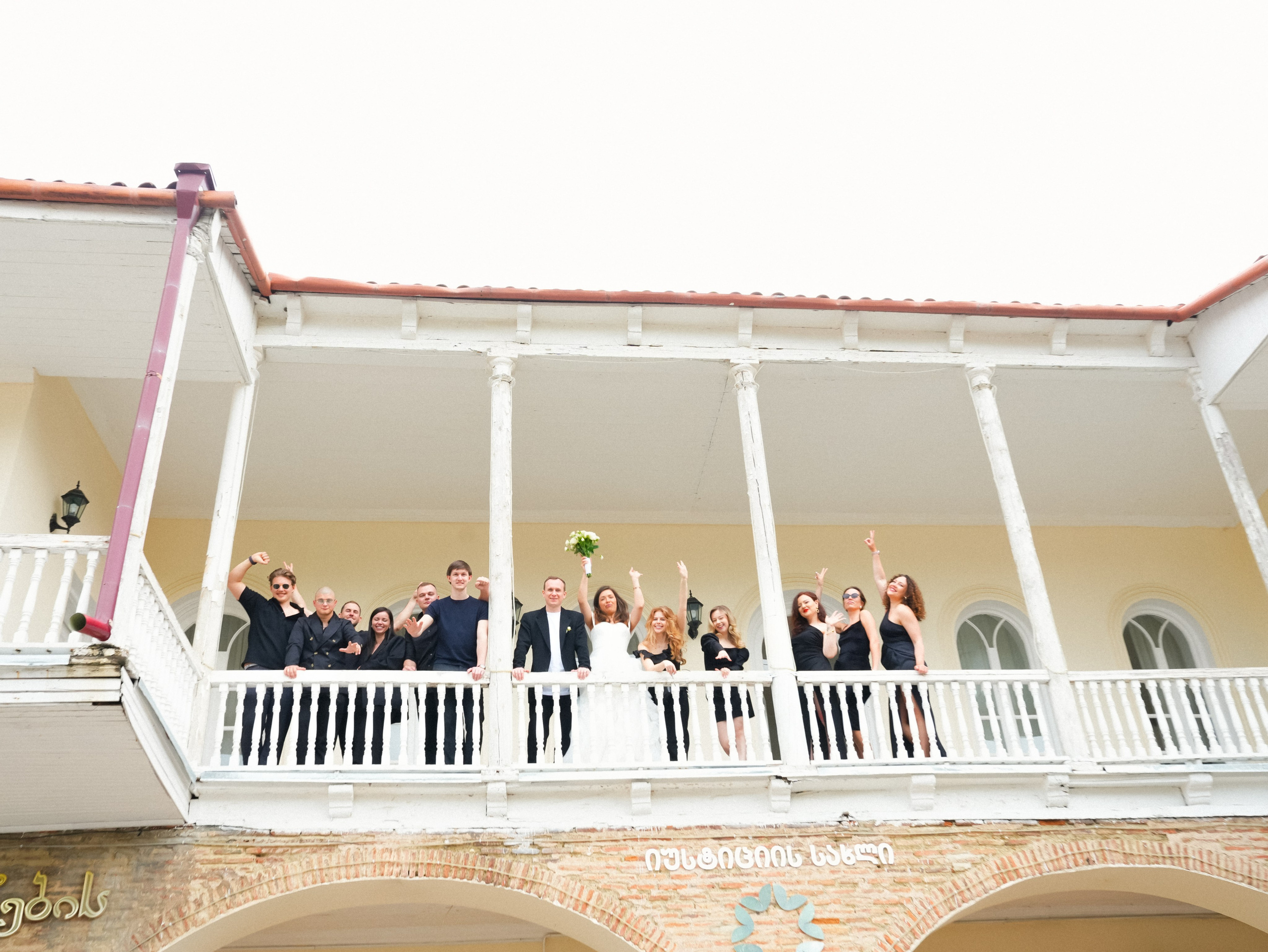 Guests on balcony overlooking courtyard