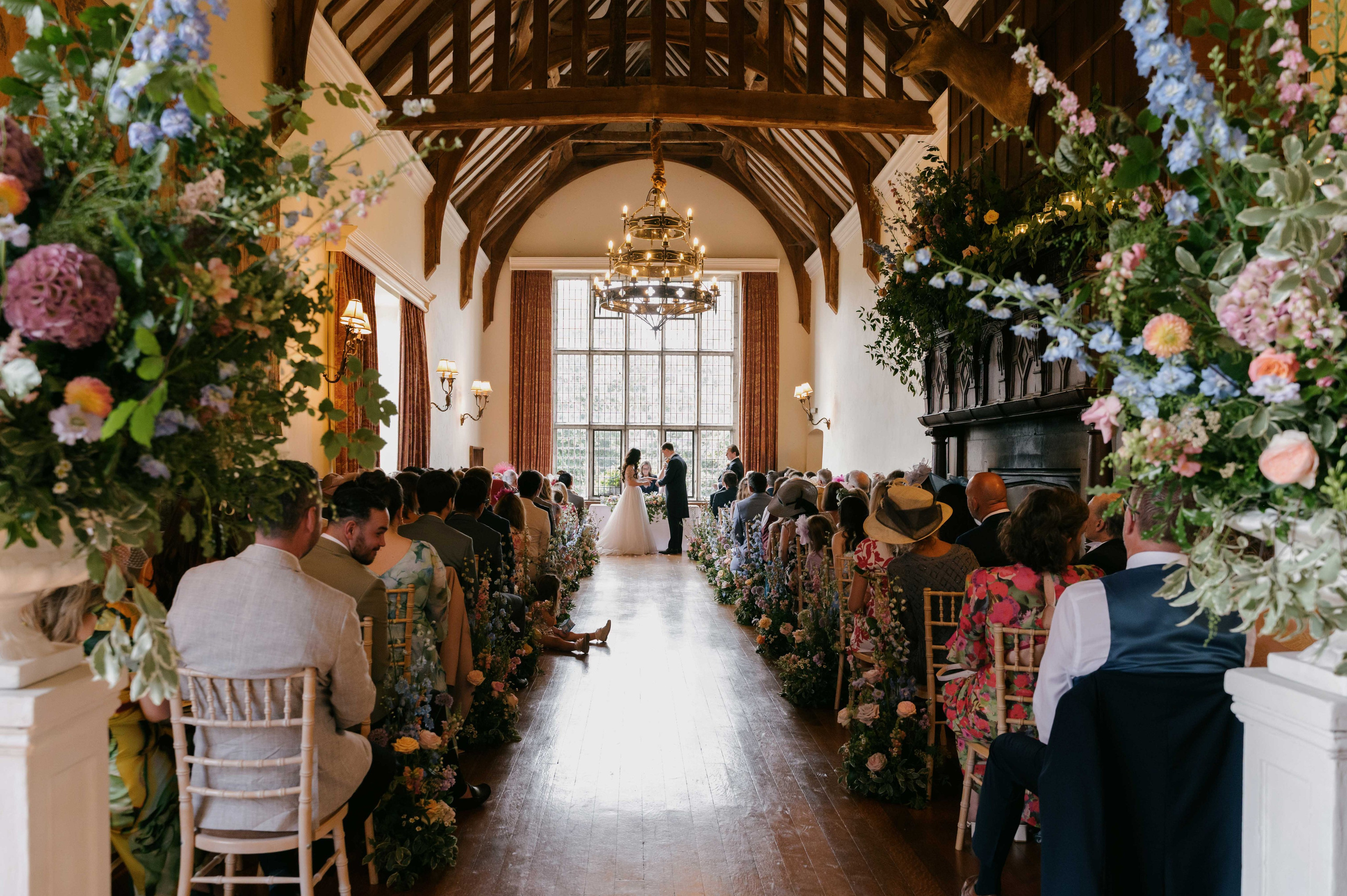    wedding ceremony indoor Layer Marney Tower Essex floral aisle