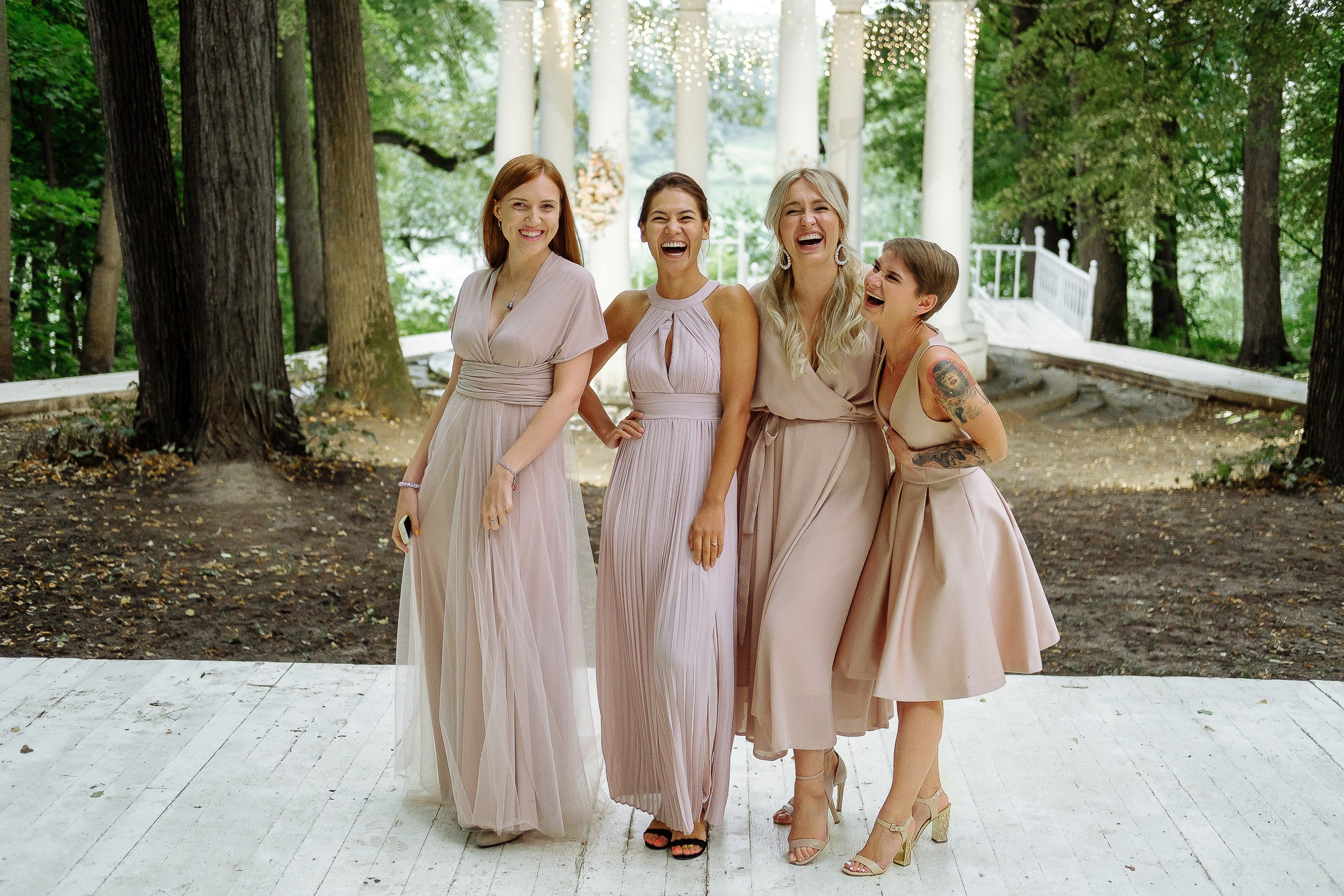 Bridesmaids laughing, by Cornwall reportage photographer.