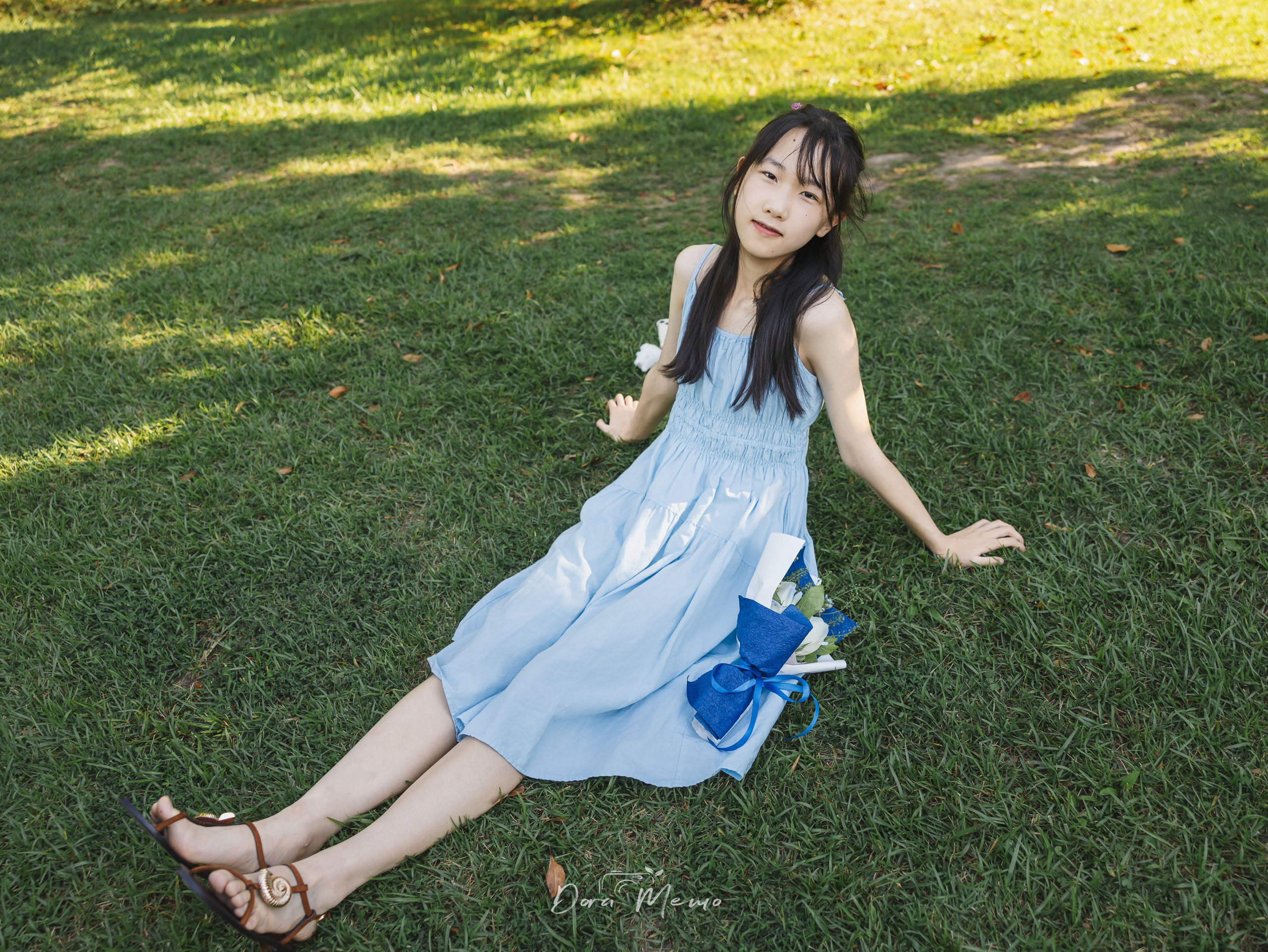 Sitting on grass, relaxed, dappled light | Sitting relaxed on the grass, dappled sunlight, natural lifestyle portrait 