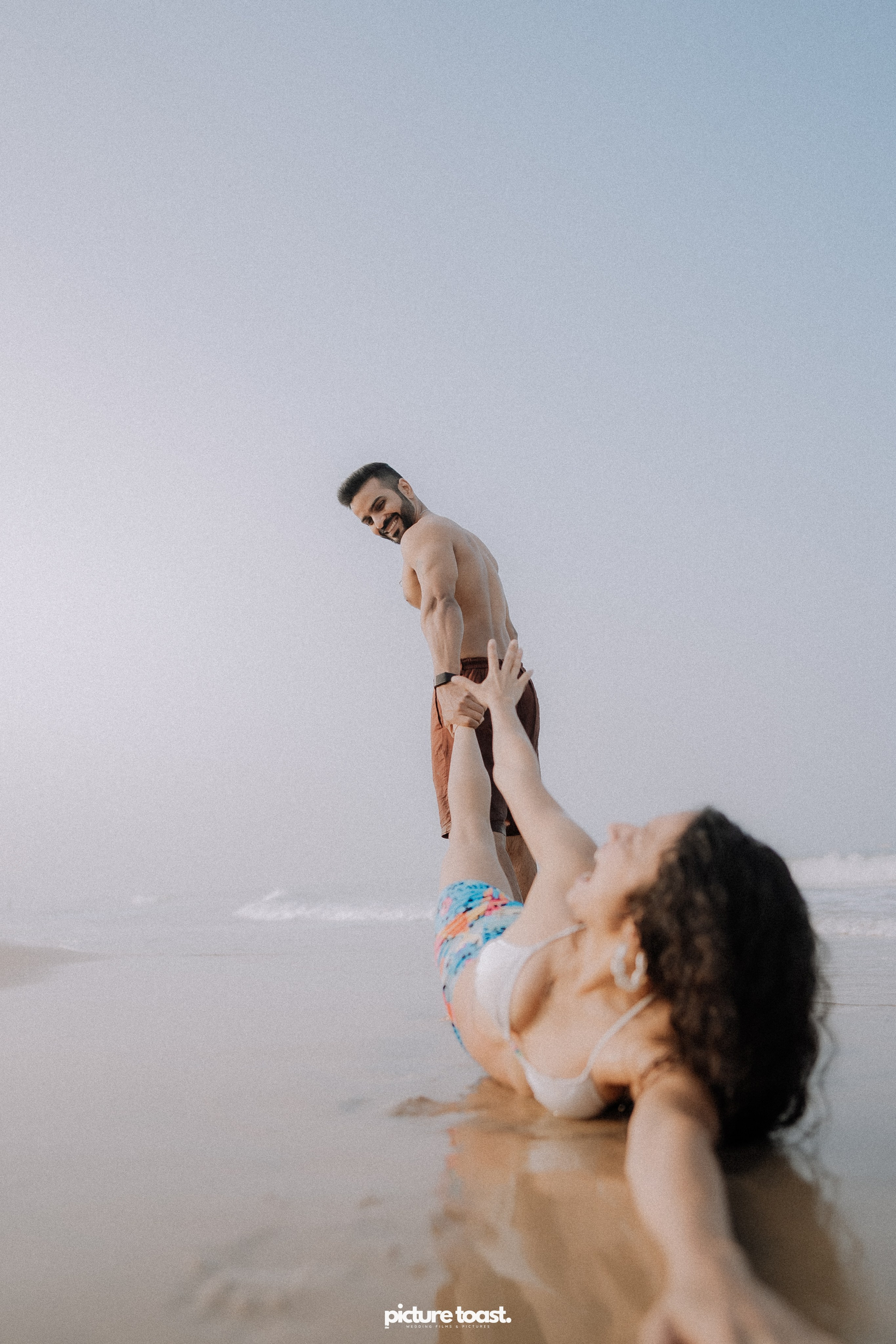 Love In The Beach. Fine art Wedding Photographers in India & Canada