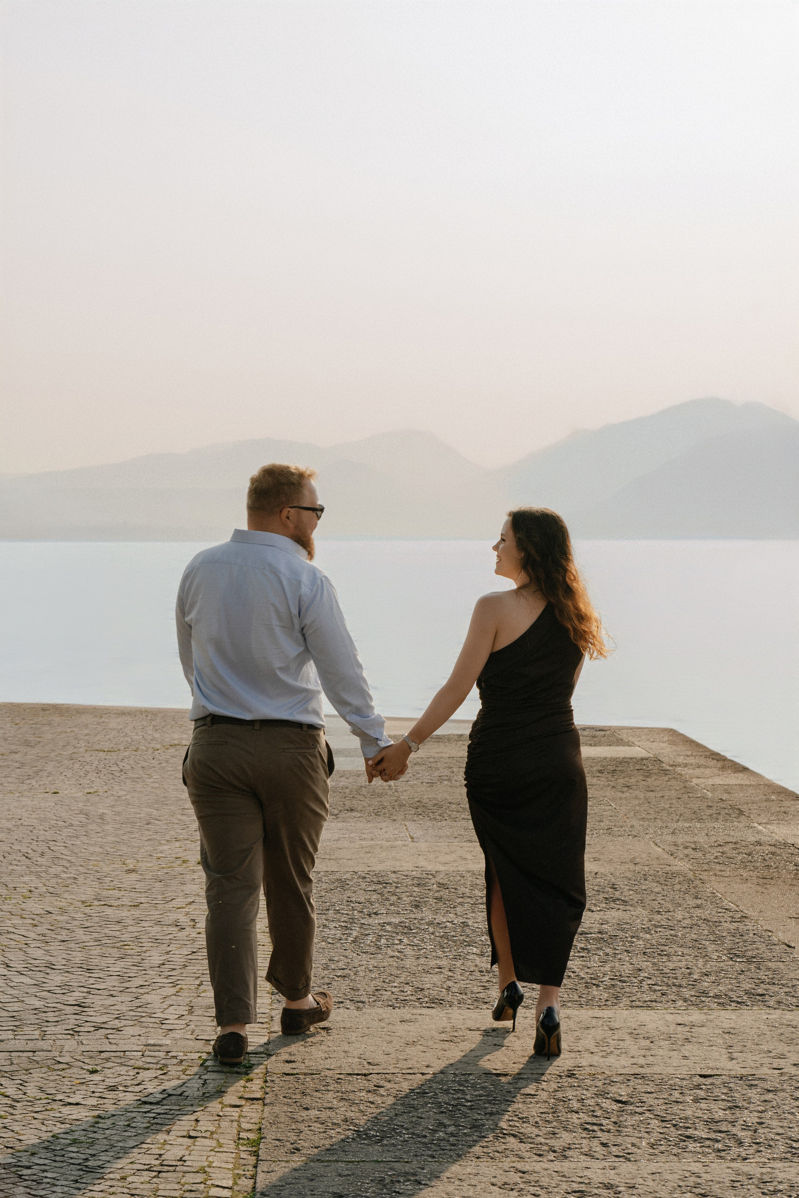 Romantic engagement on Lake Garda during a sunset boat proposal in Torri del Benaco