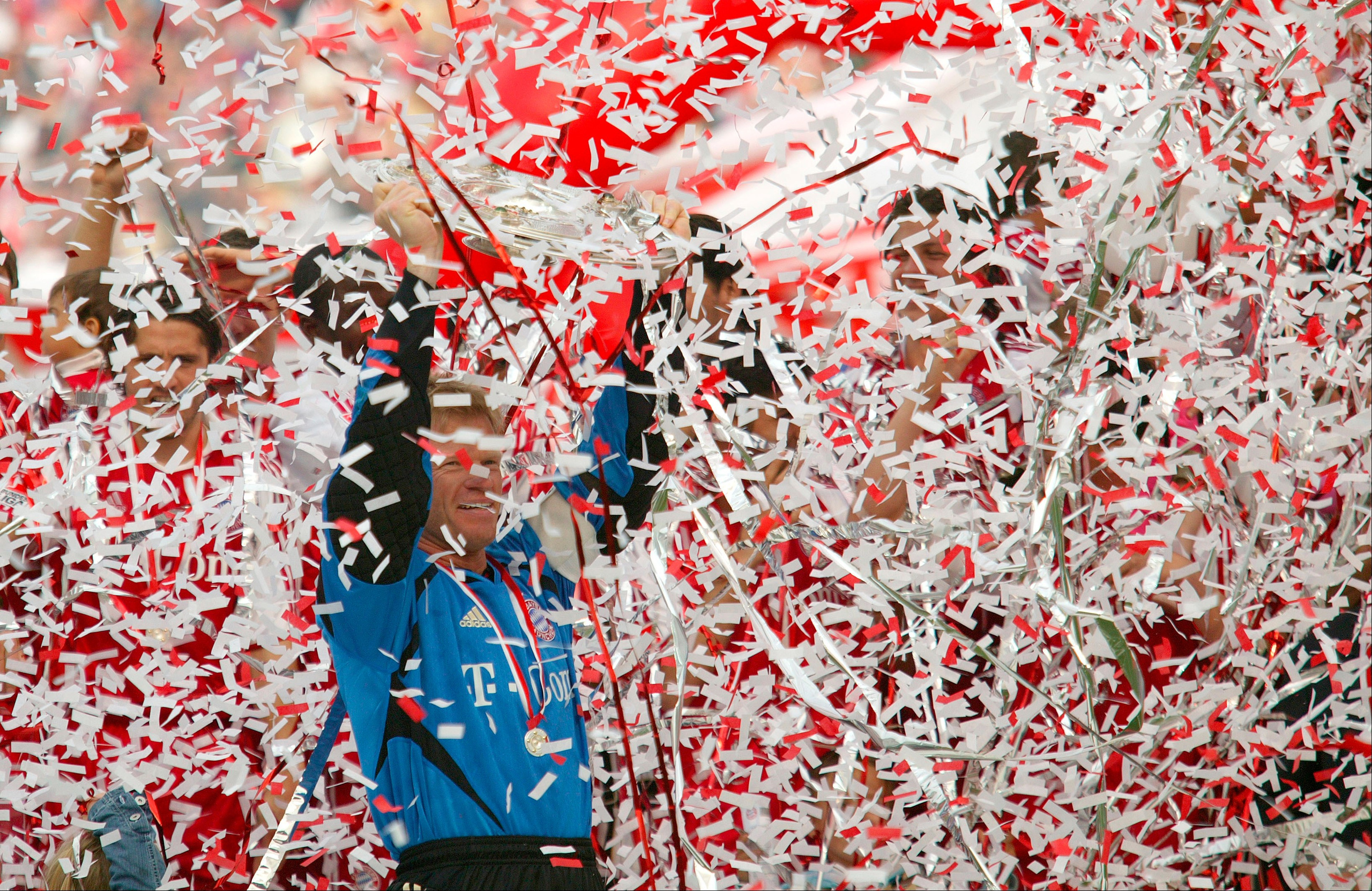 Goalkeeper Oliver Kahn of Munich celebrates with the trophy after the 1. Bundesliga match between FC Bayern Munich and 1.FC Nuremberg at the Olympic Stadium on May 14, 2005 in Munich, Germany.