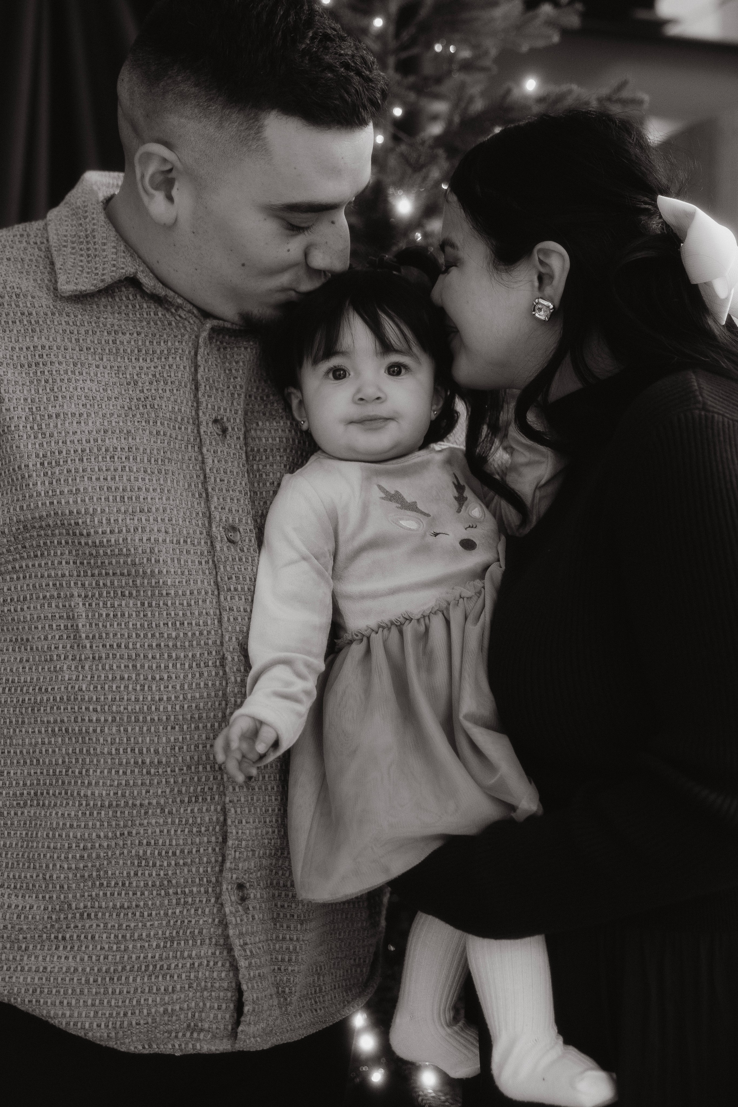 Black and white portrait of mother and baby during a Christmas photo session