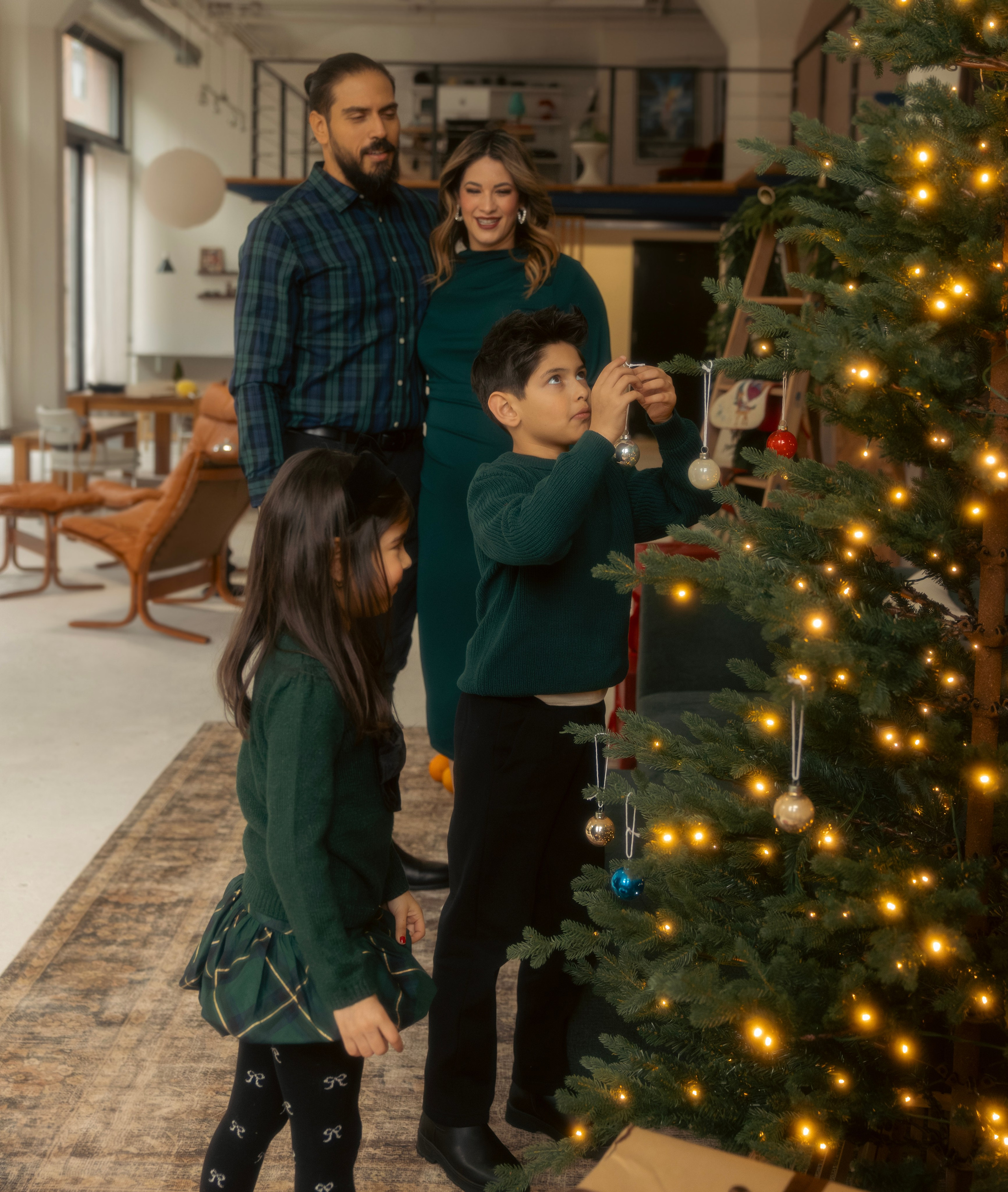 19. Parent and child by the Christmas tree during a Chicago holiday mini session