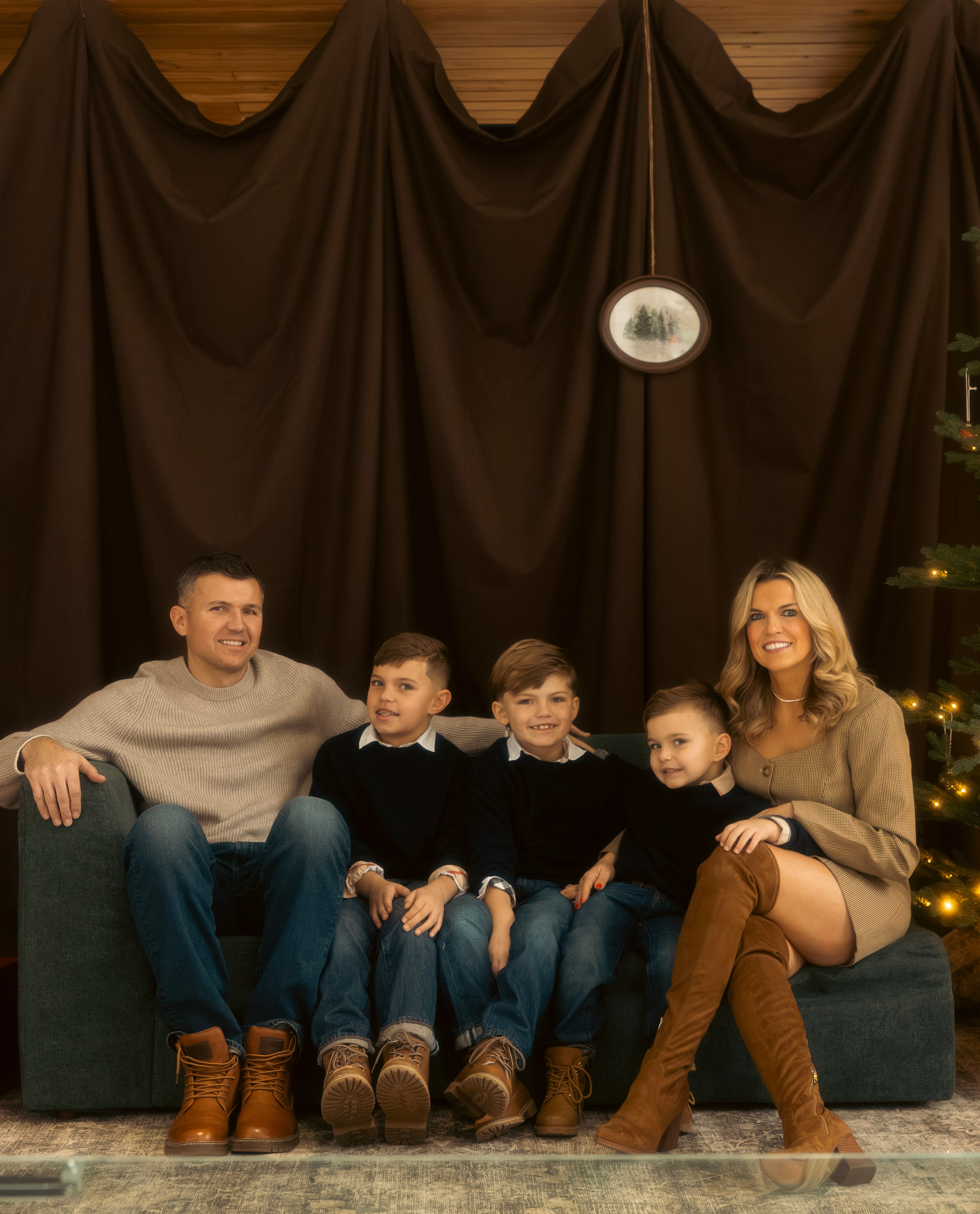 Family relaxing together on a sofa during a holiday photo session