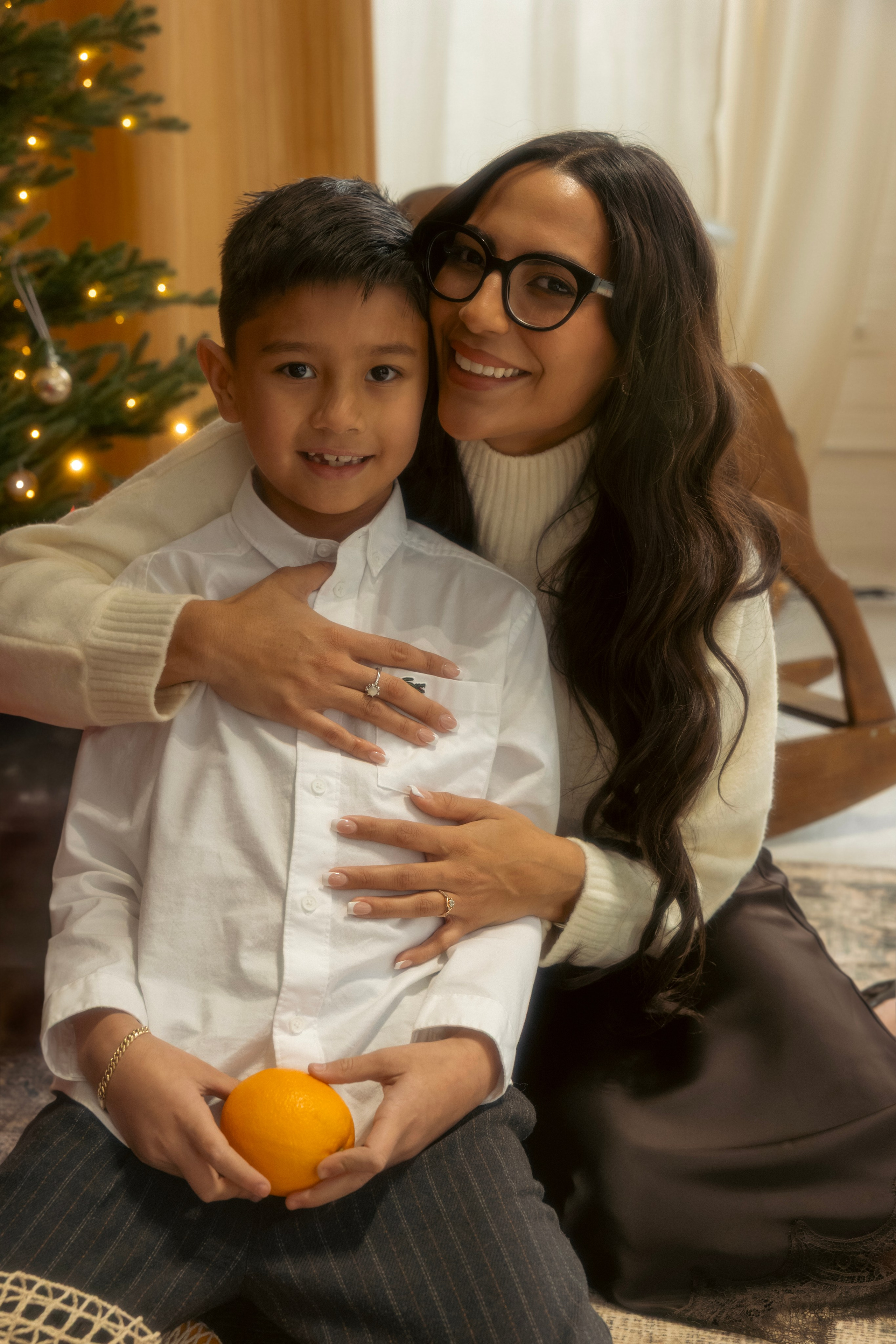 Mother and child sharing a sweet moment during a Christmas family photo session