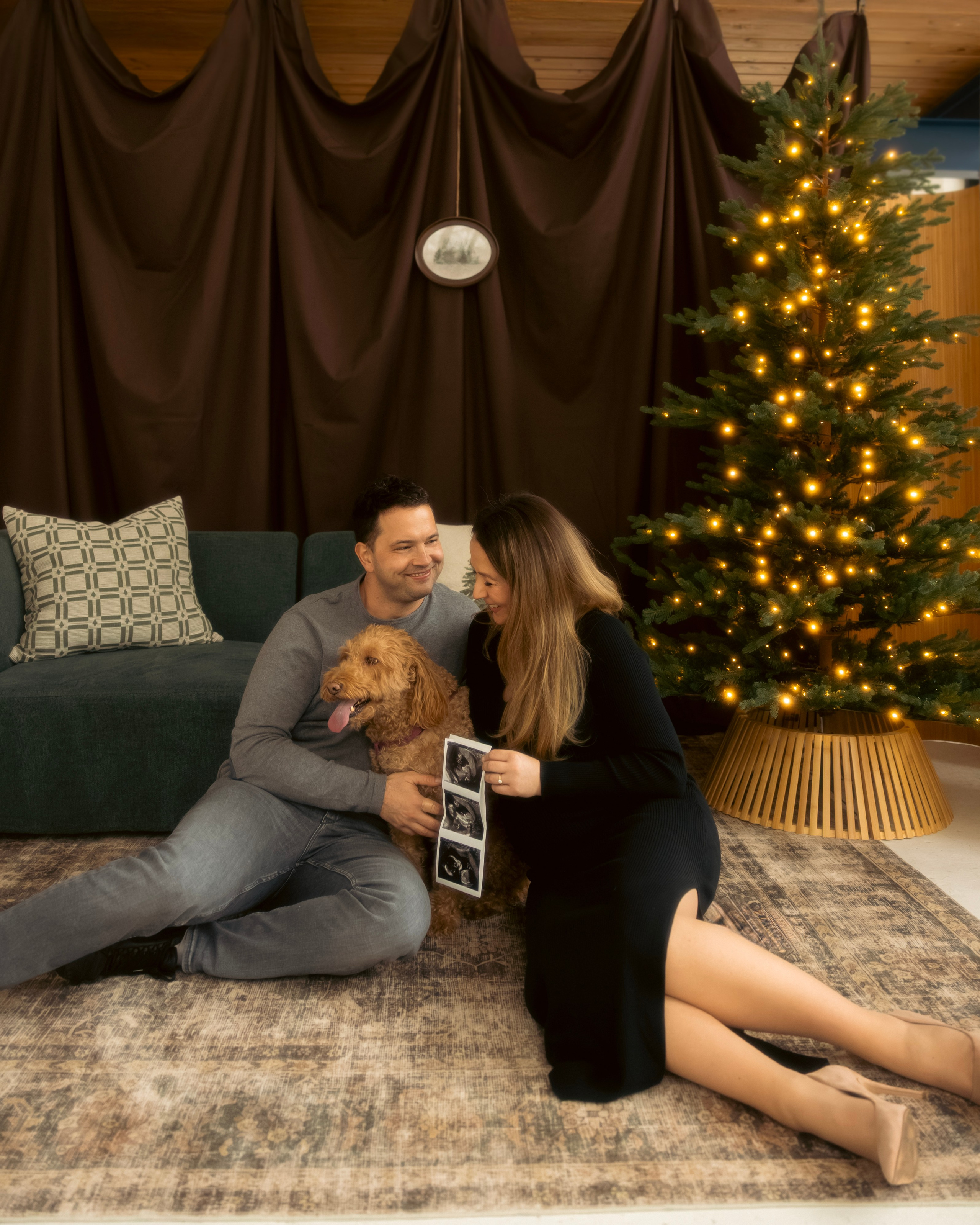 Mother and baby sitting by a Christmas tree during a Chicago mini session