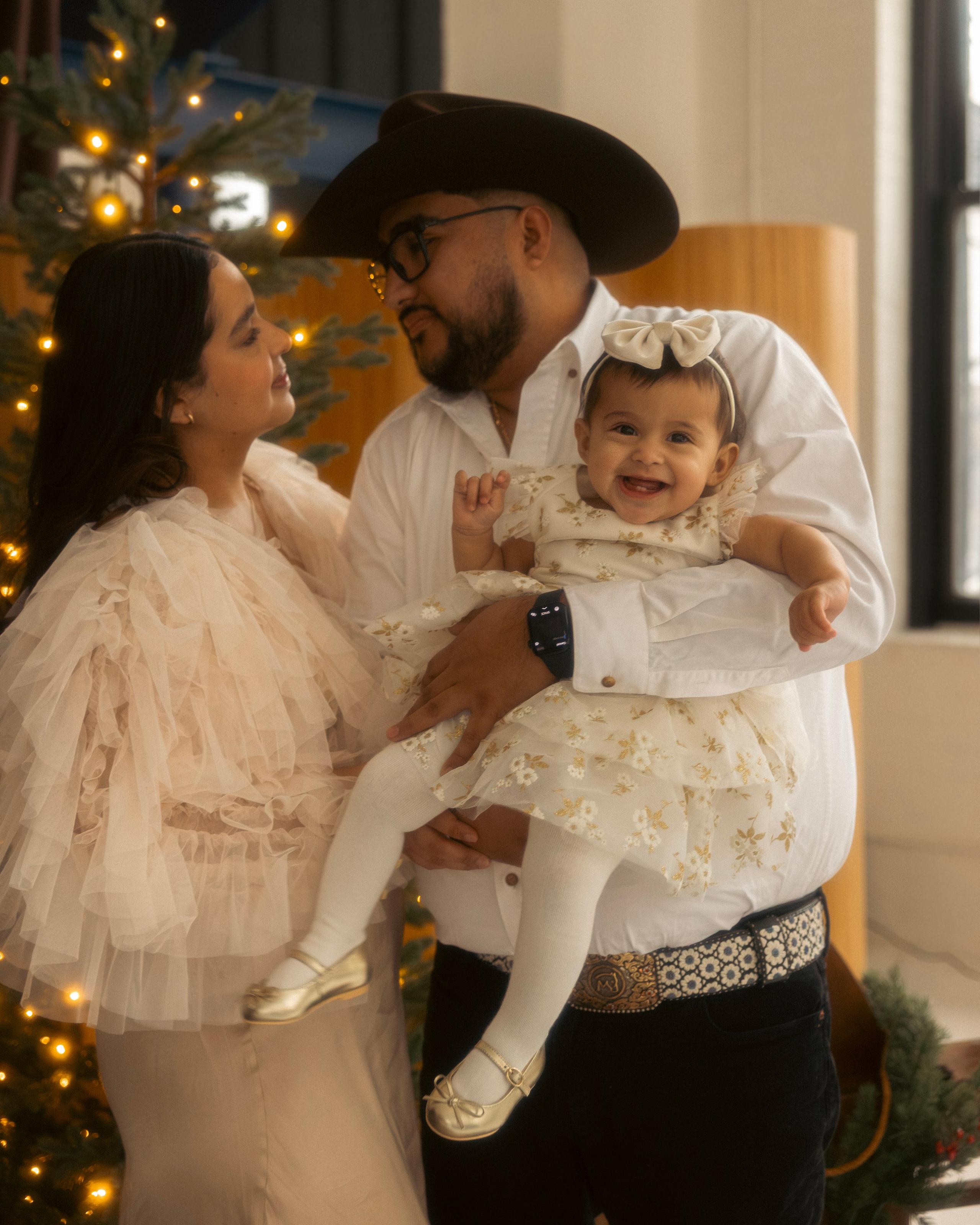 Family sharing a joyful moment during a cozy Christmas photo session in Chicago