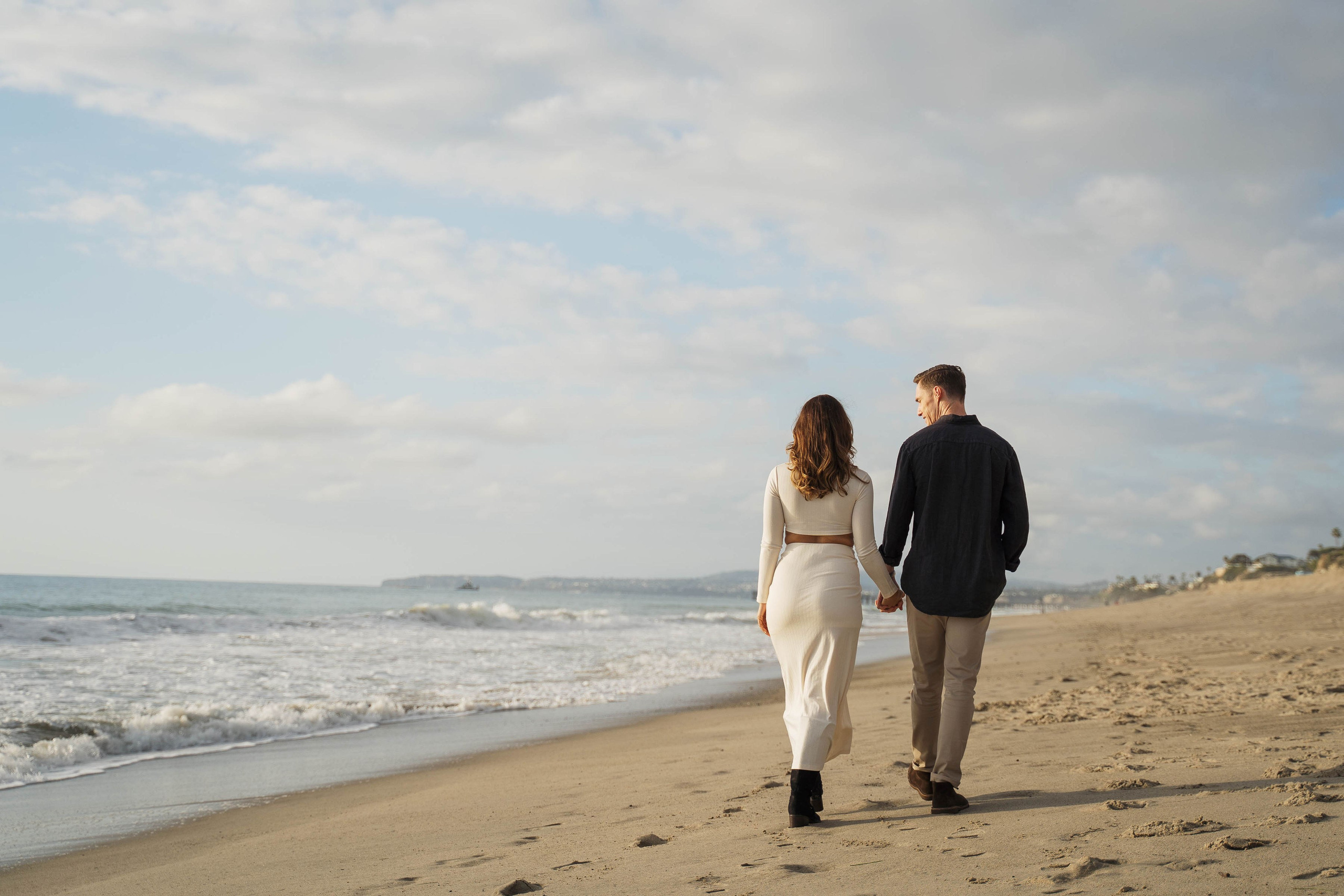 Engagement session at the beach light and airy photo