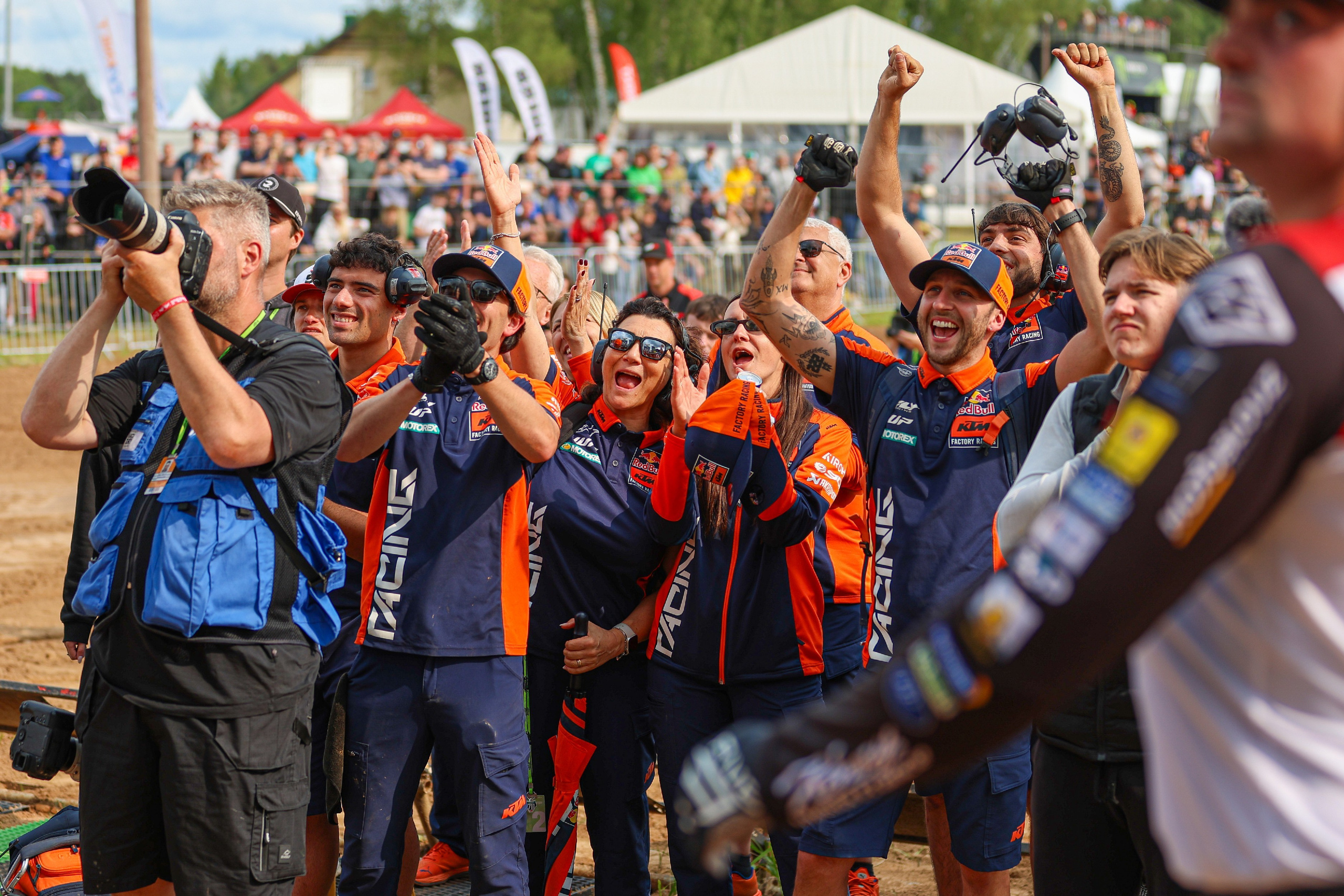 KTM crew celebrating in front of the podium MXGP Motocross World Championship