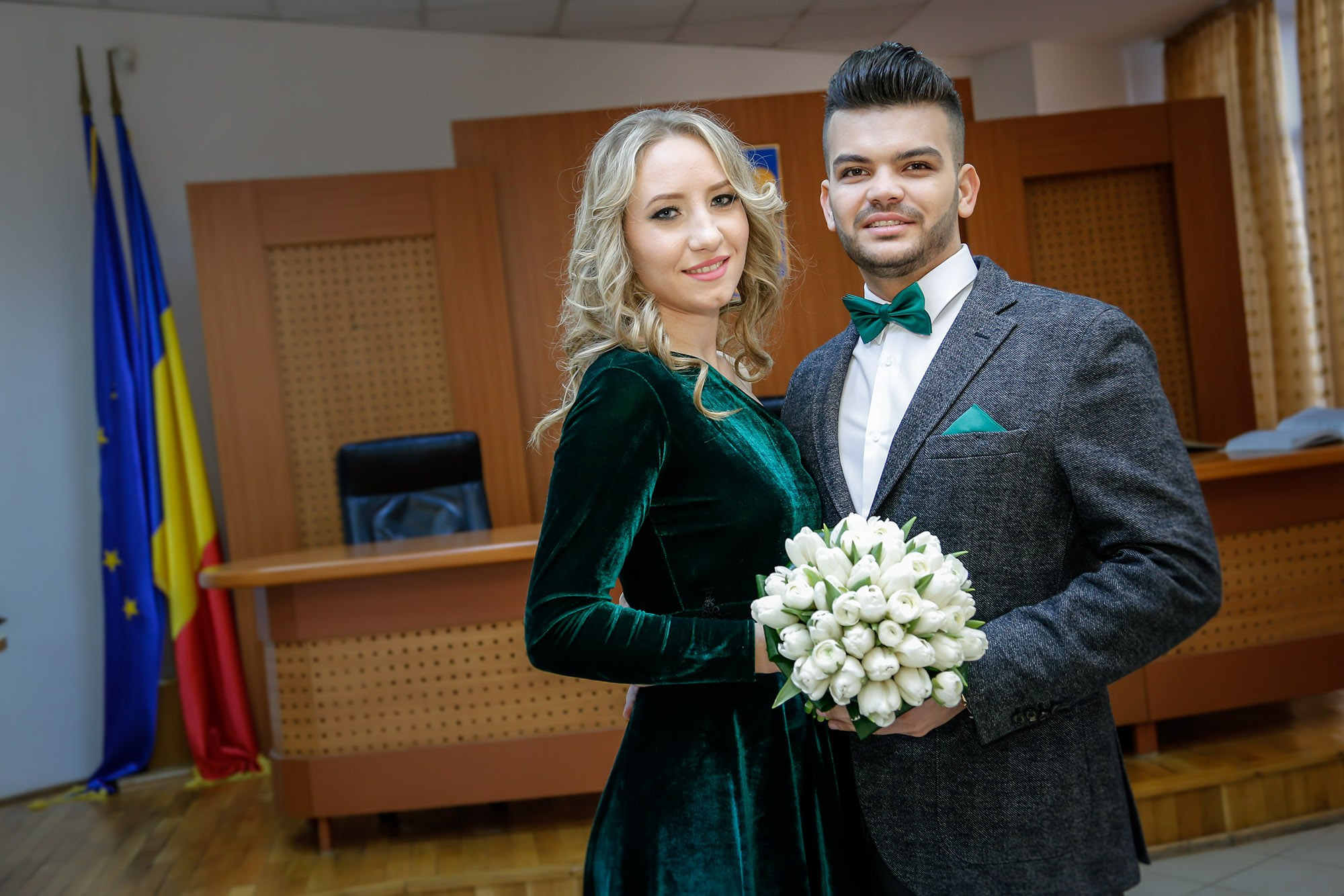 Elegant couple portrait of the newlyweds inside the civil registry hall.