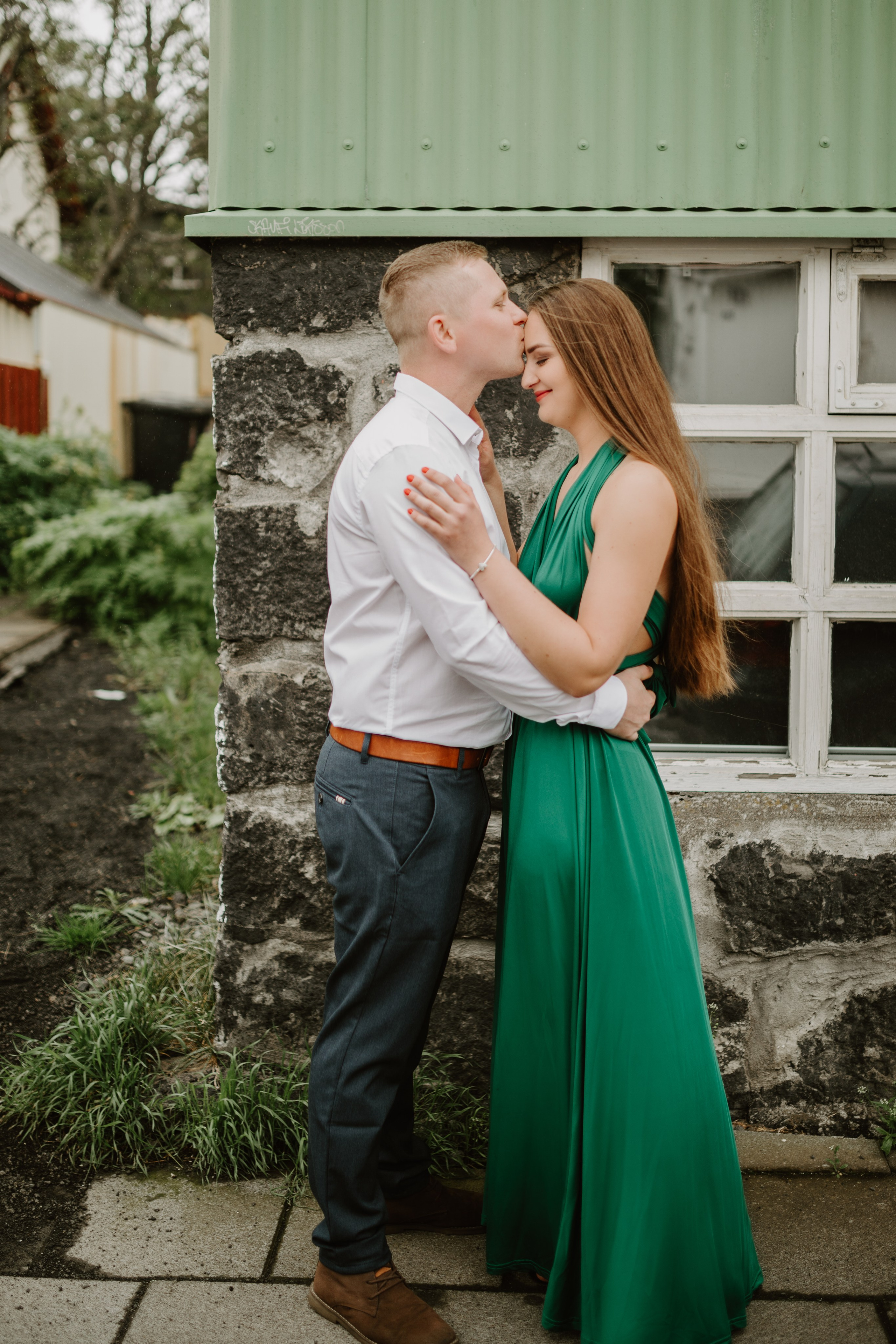 Passionate couple’s portrait session in Iceland, capturing raw emotions against Reykjavik down town