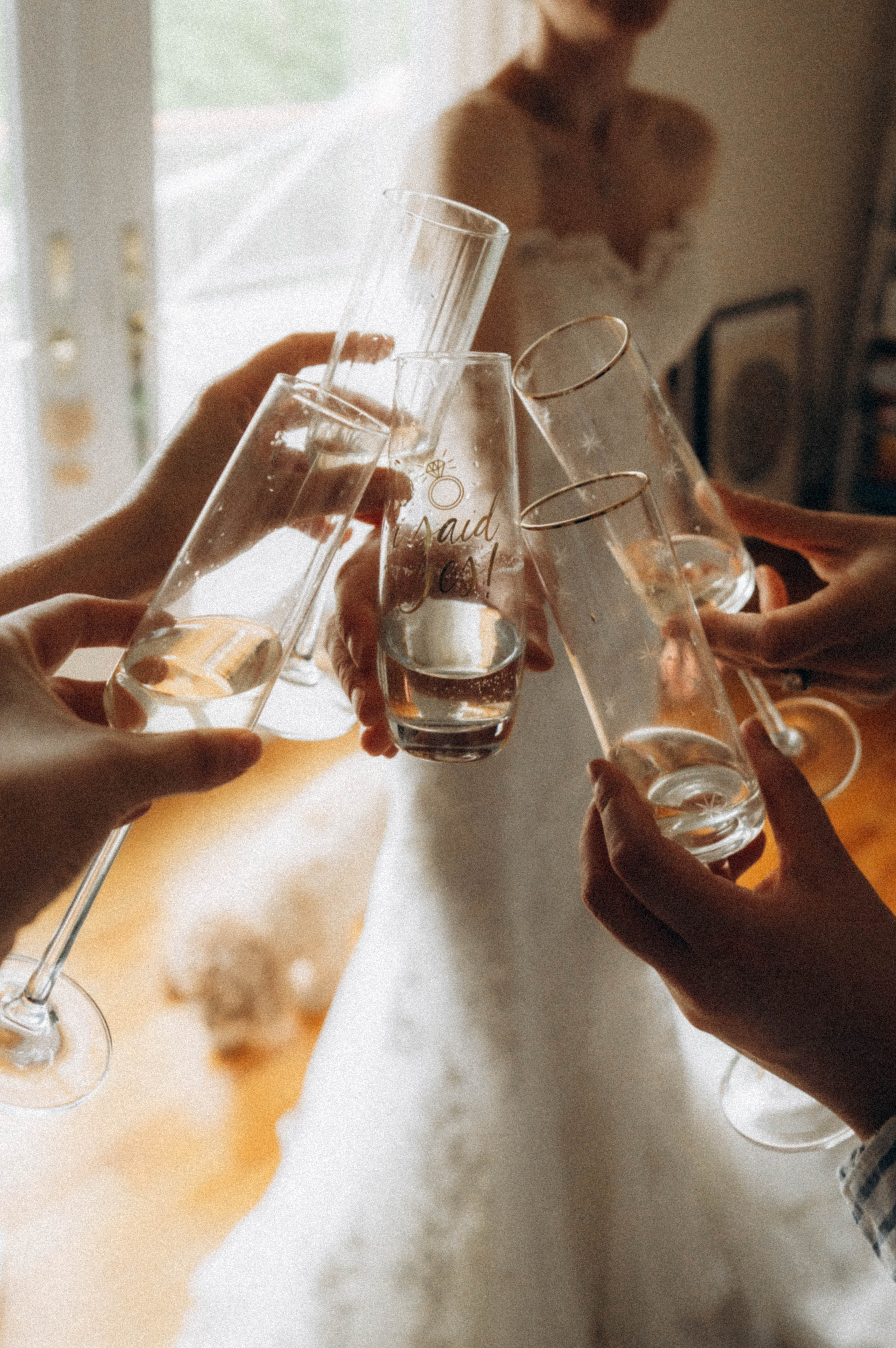 Bride standing by Glens Falls waterfall in summer.