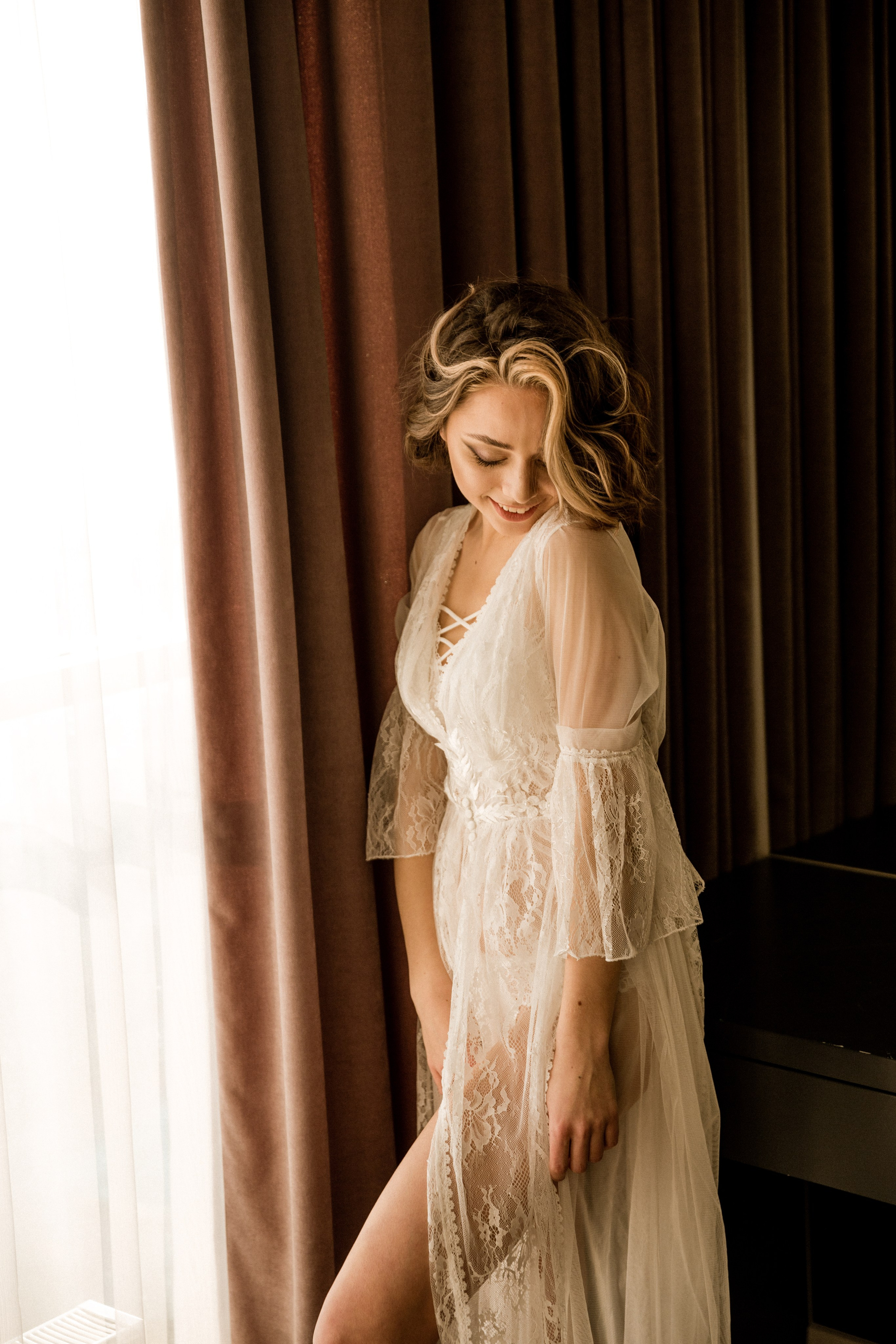 Wedding couple photoshoot on the beach with waves and sunset, destination wedding photography Spain