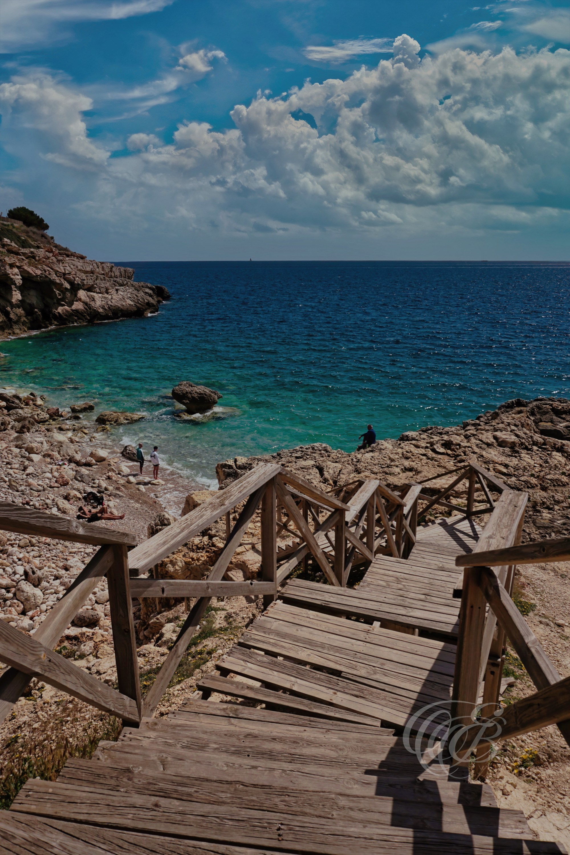 Stairway at Punta des Grells leading through the coastal area, connecting different levels of the rocky landscape near the shoreline of Palma. The structure blends into the natural surroundings, providing access across the uneven terrain of the cliffside environment. Eduardo Bartoli Photography.