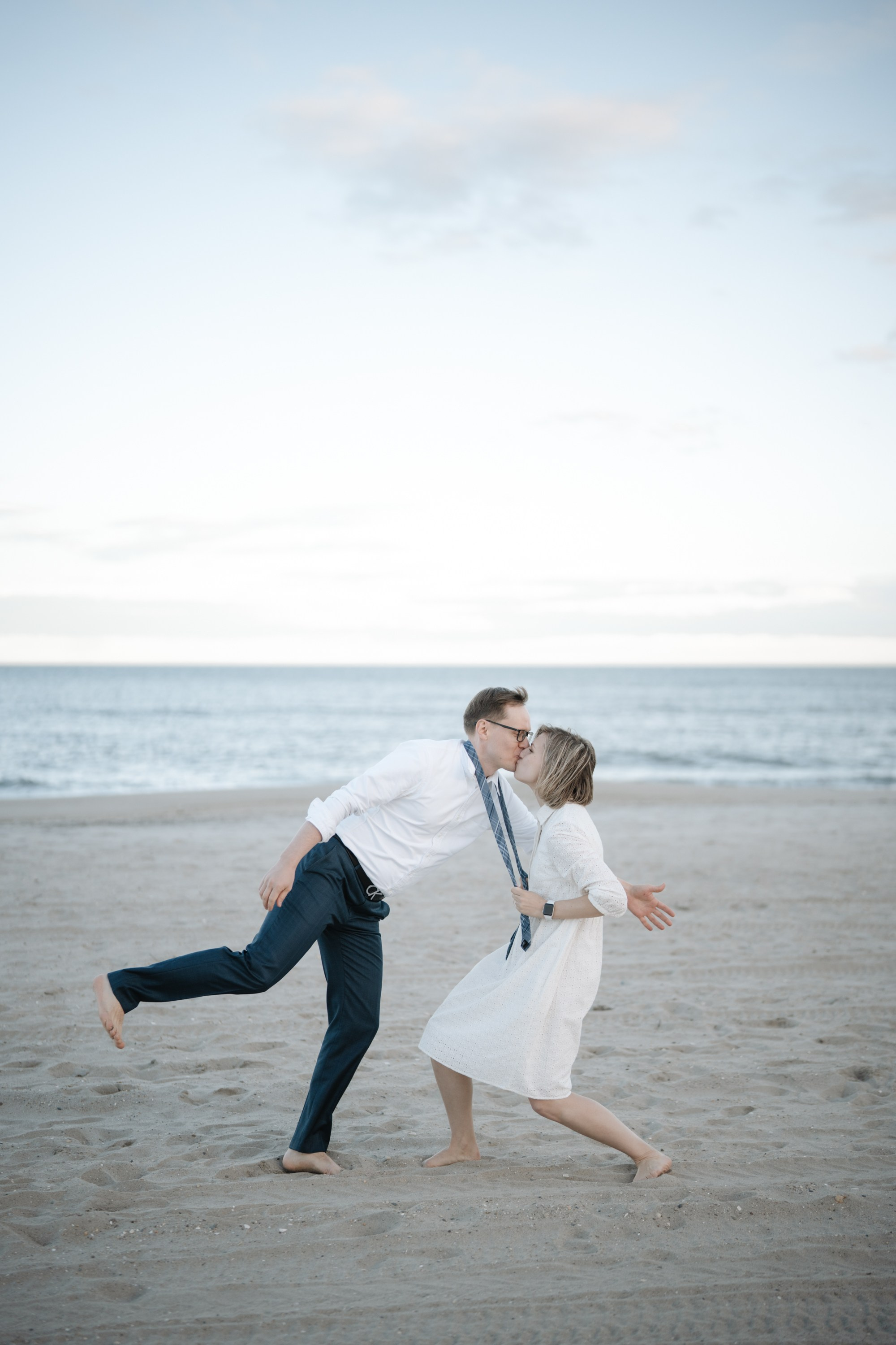 Candid photos of a couple on the beach. Portrait and wedding photographer in New York