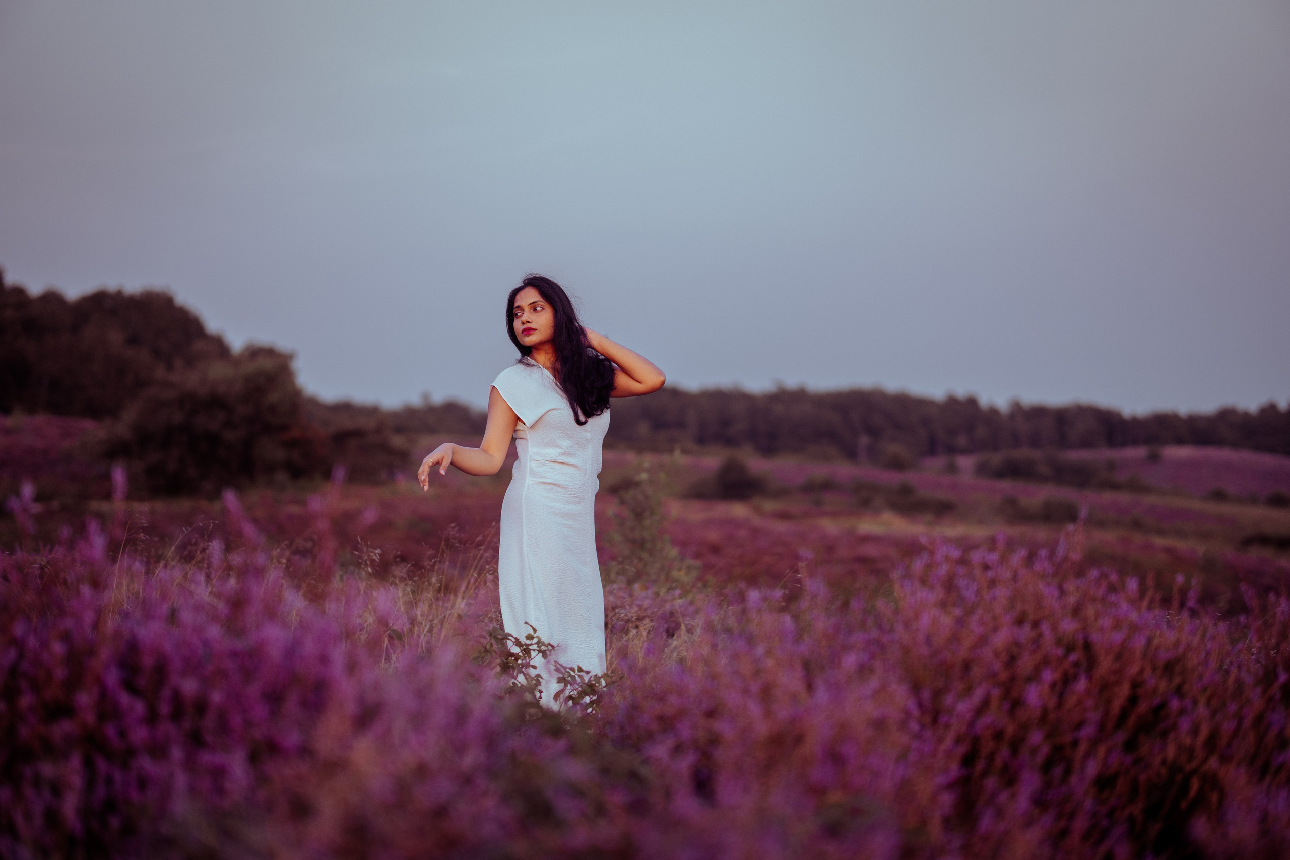 woman standing in veluwe heather fields netherlands