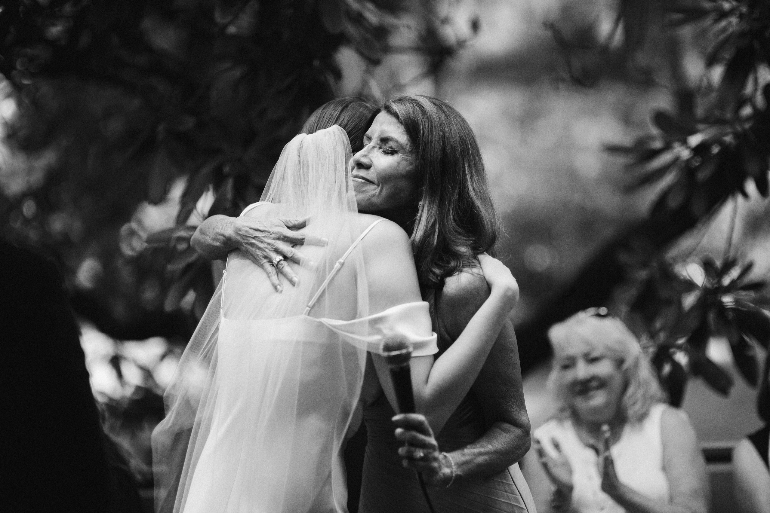 Bride and groom dancing, black and white joyful moment