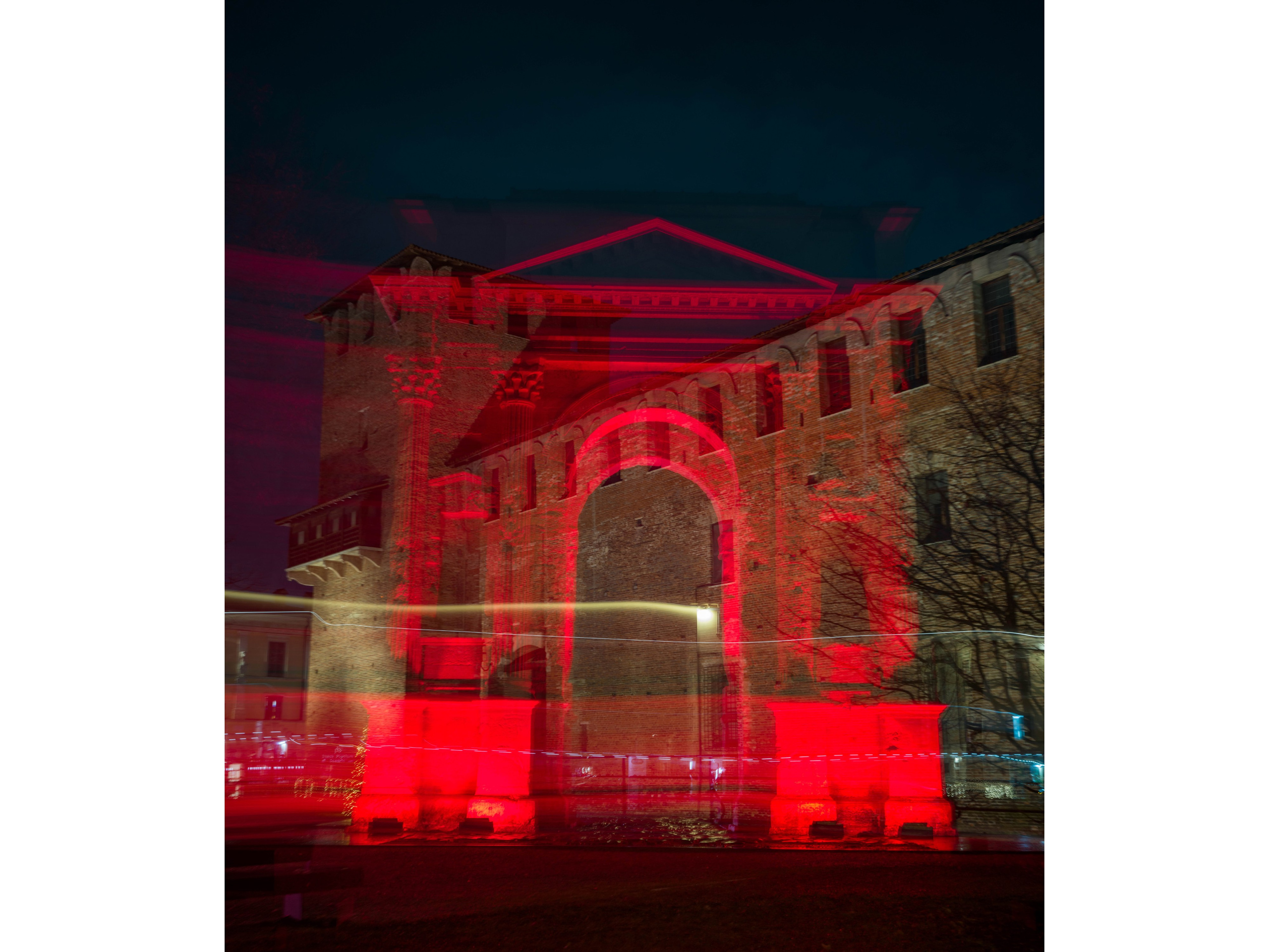 Long exposure light painting at Arco dei Gavi in Verona. A historic Roman monument transformed into contemporary fine art through red light and movement.