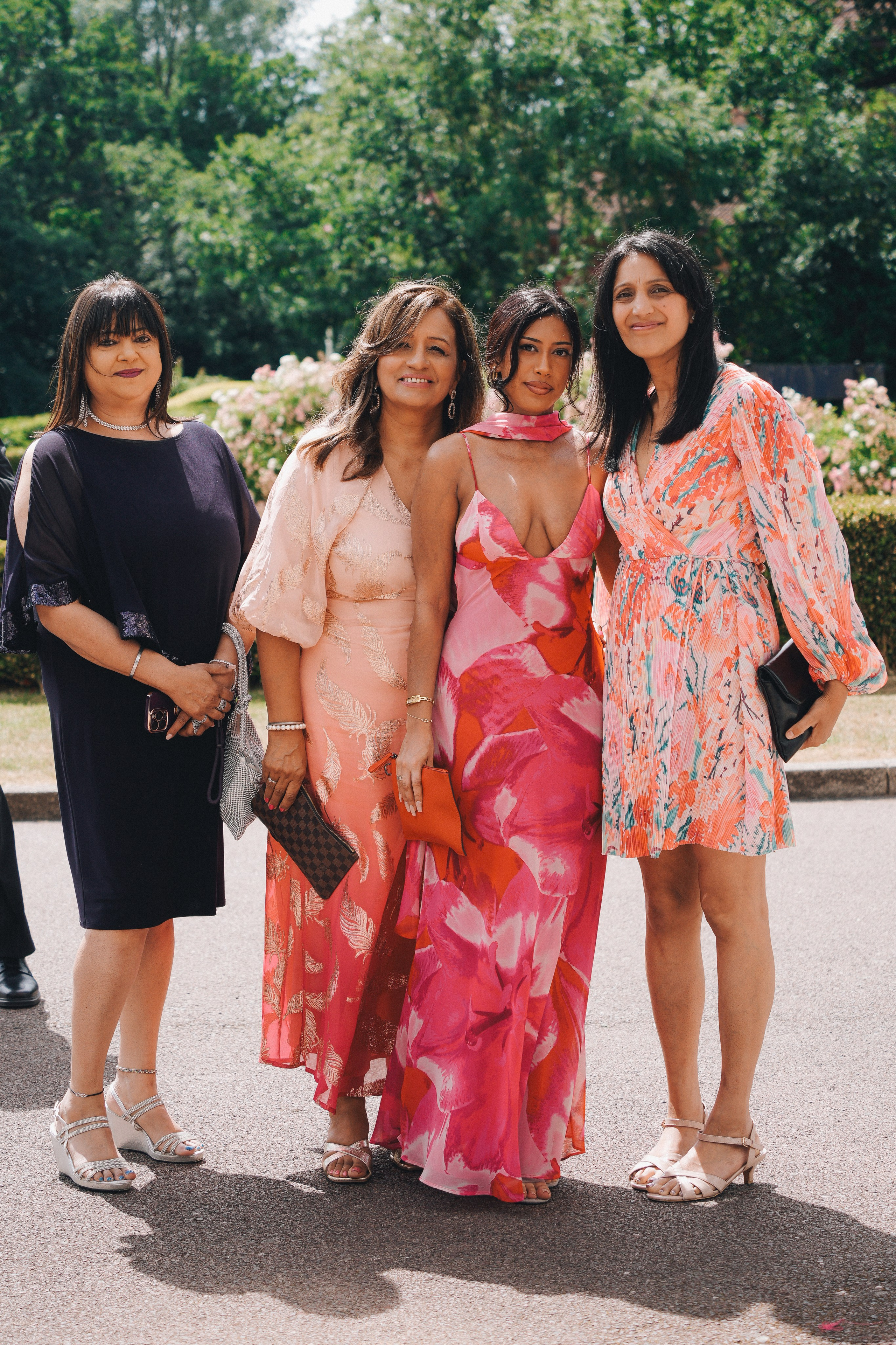 Best friends embracing the bride during the evening celebration