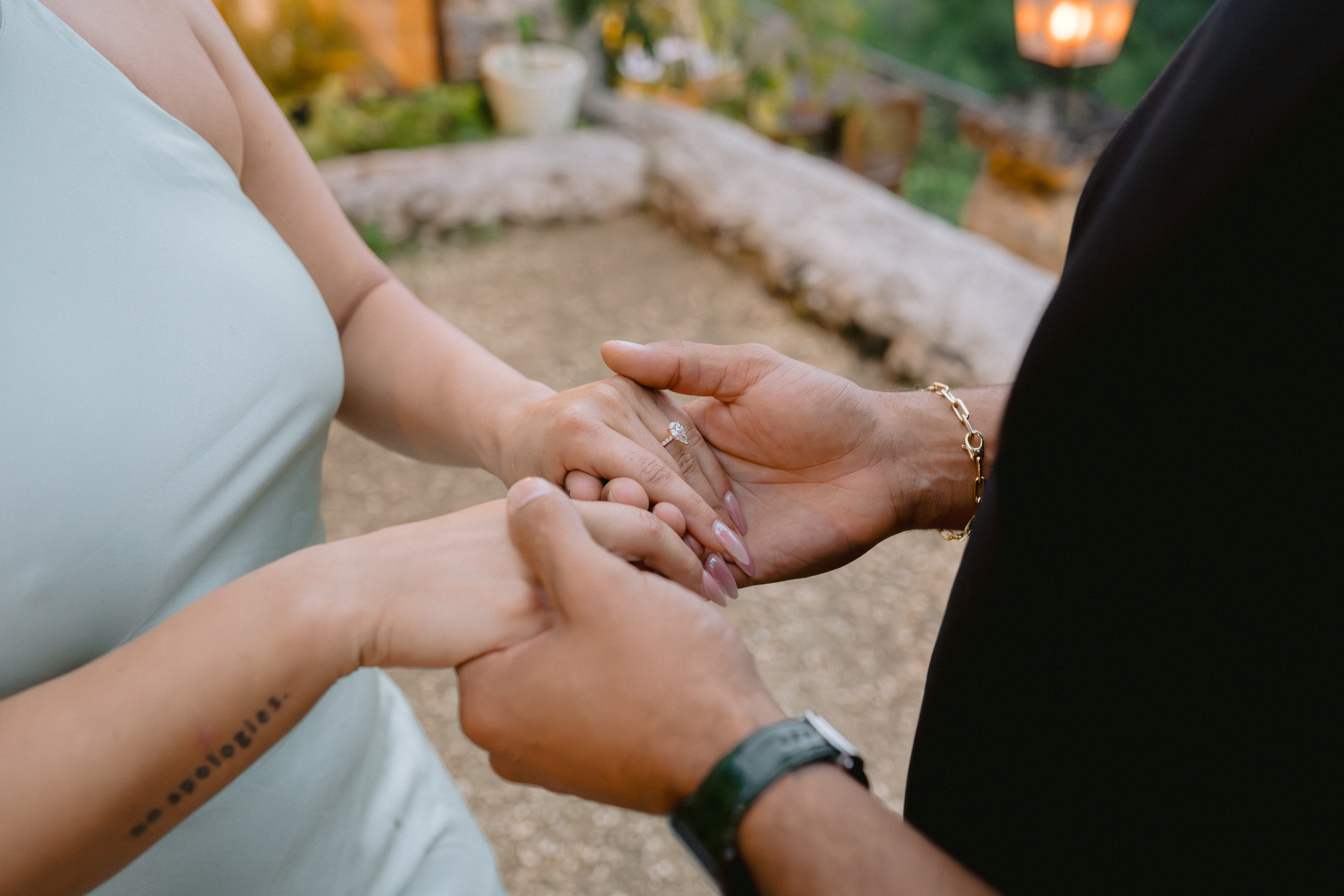 Man proposing to a woman at a scenic overlook with a river valley in the background, surrounded by rustic stone of Altos de chavon. Punta cana wedding family fashion photographer dominican republic, destination wedding photographer, elopement photography Punta Cana