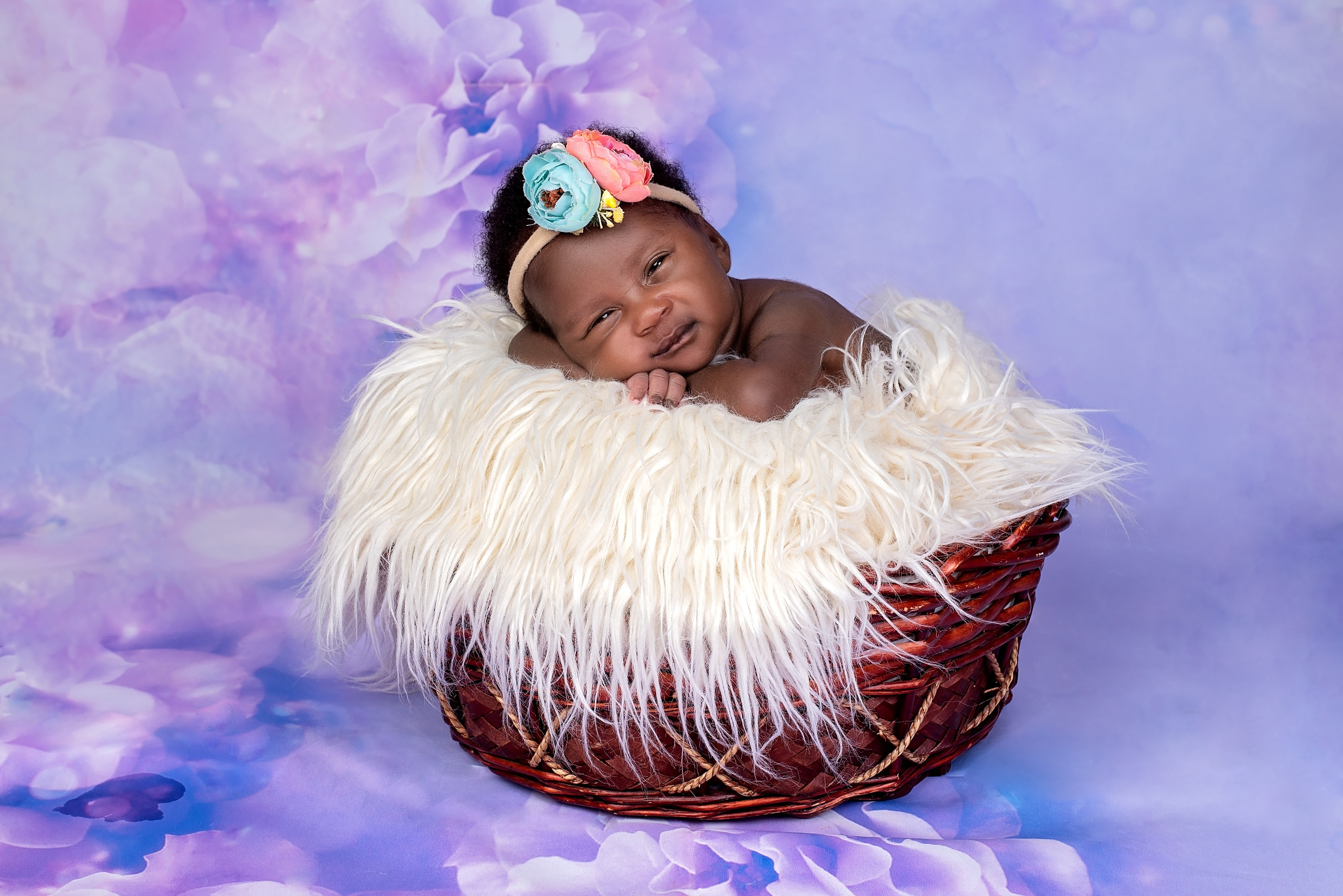 Black newborn baby girl 3 weeks laying inside basket Mombasa Kenya