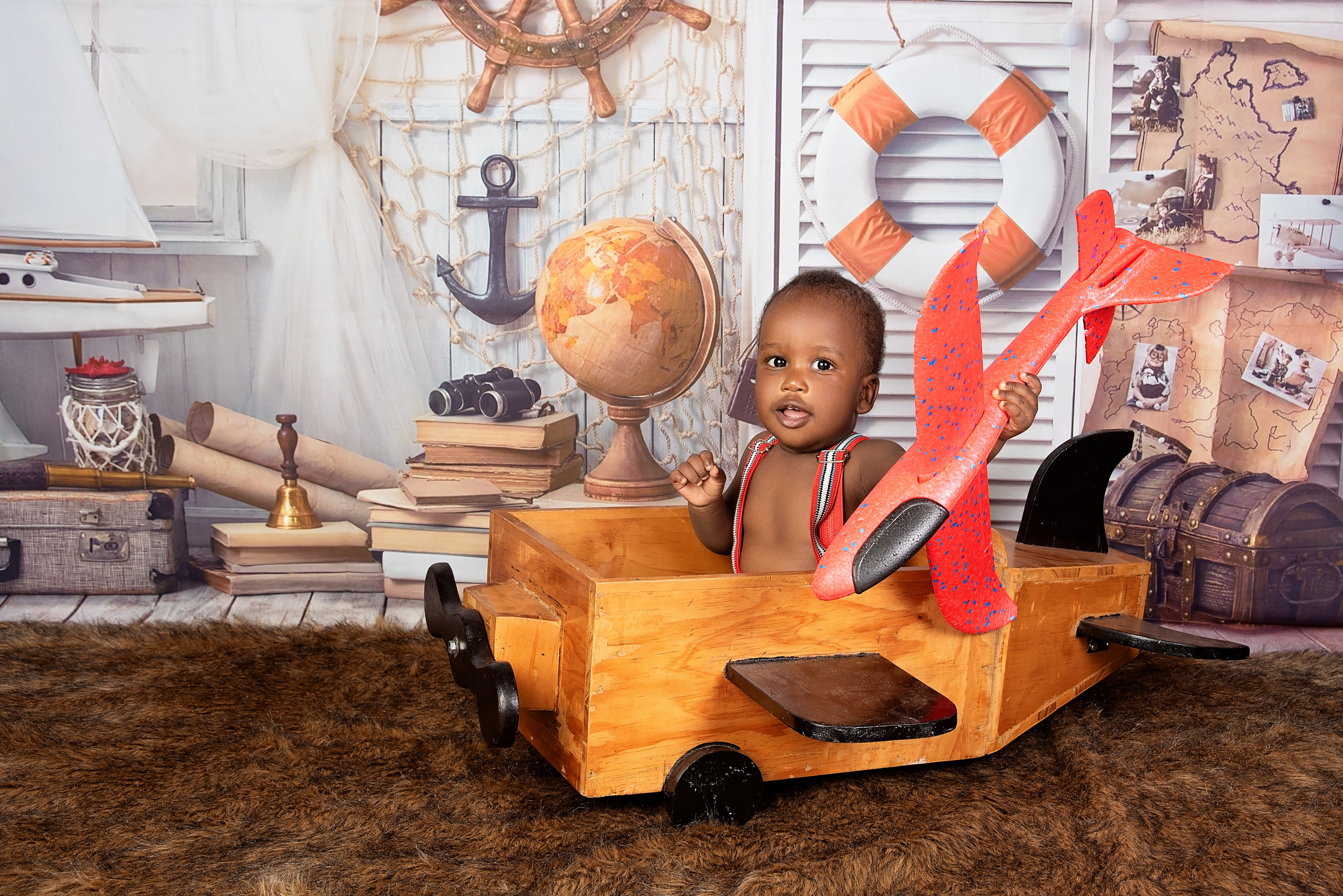 10 months newborn baby boy in the wooden plane photo shoot Nairobi Kenya