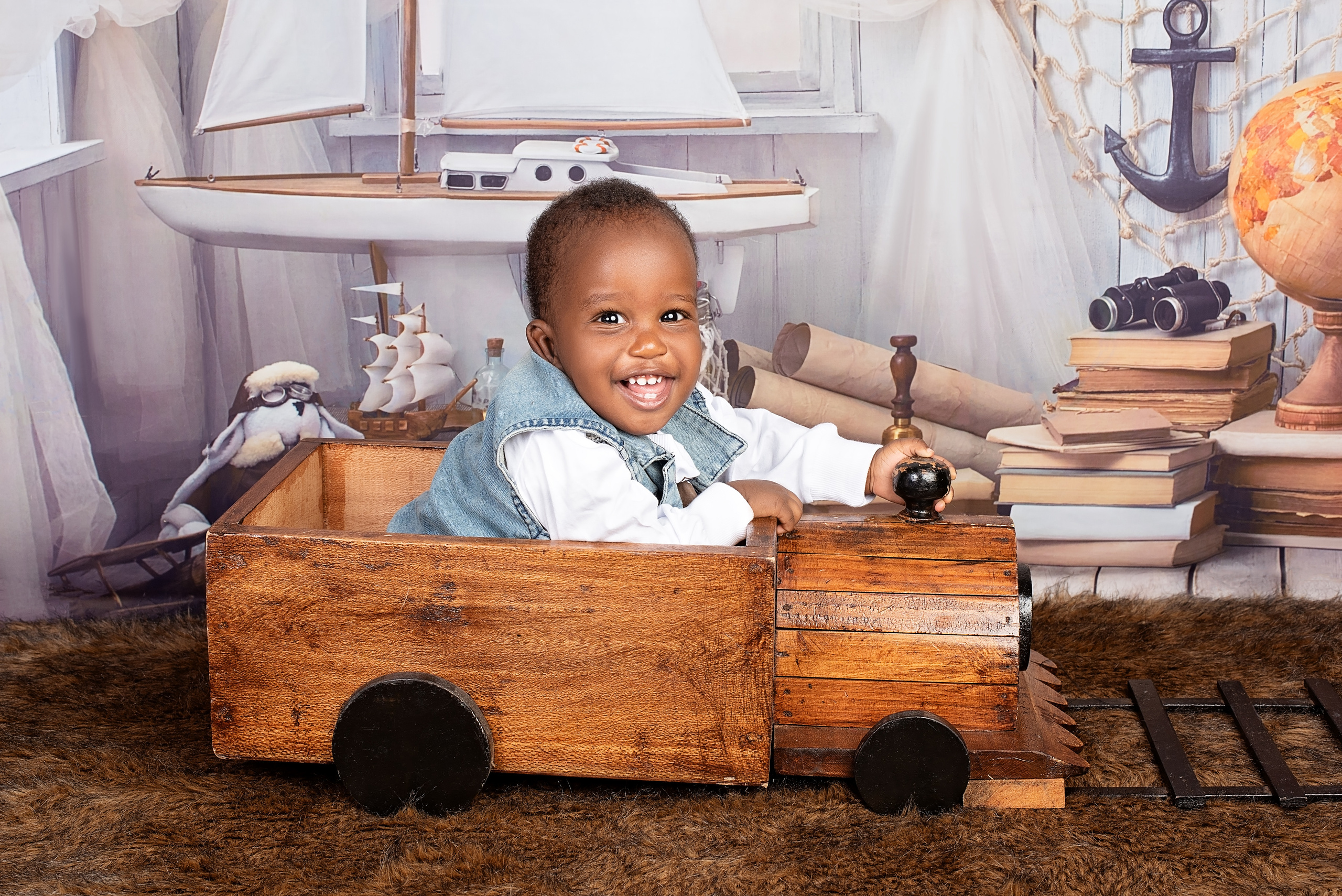 10 months African baby boy in the wooden train photo shoot Mombasa Kenya 