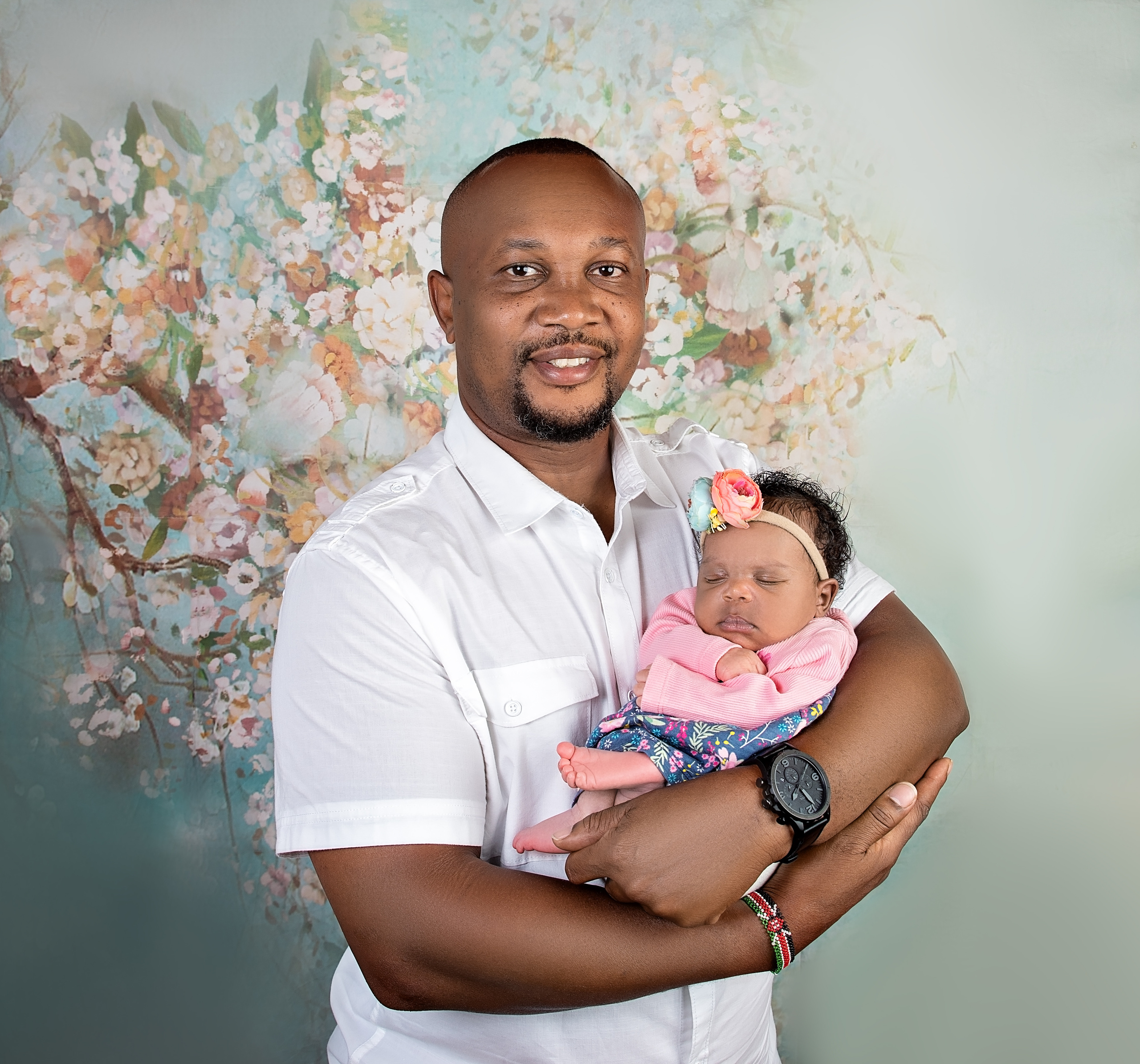 Handsome black father with 10 days newborn baby girl photoshoot Mombasa Kenya 