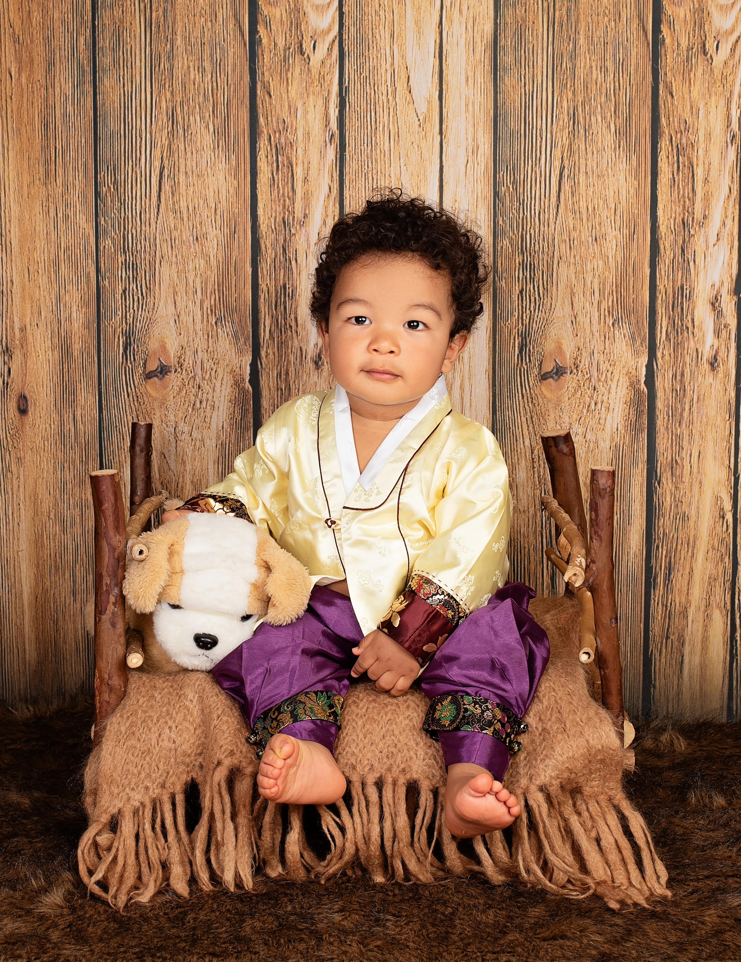 Kenyan Korean 1 year boy sitting in the bed photo shoot Nairobi Mombasa