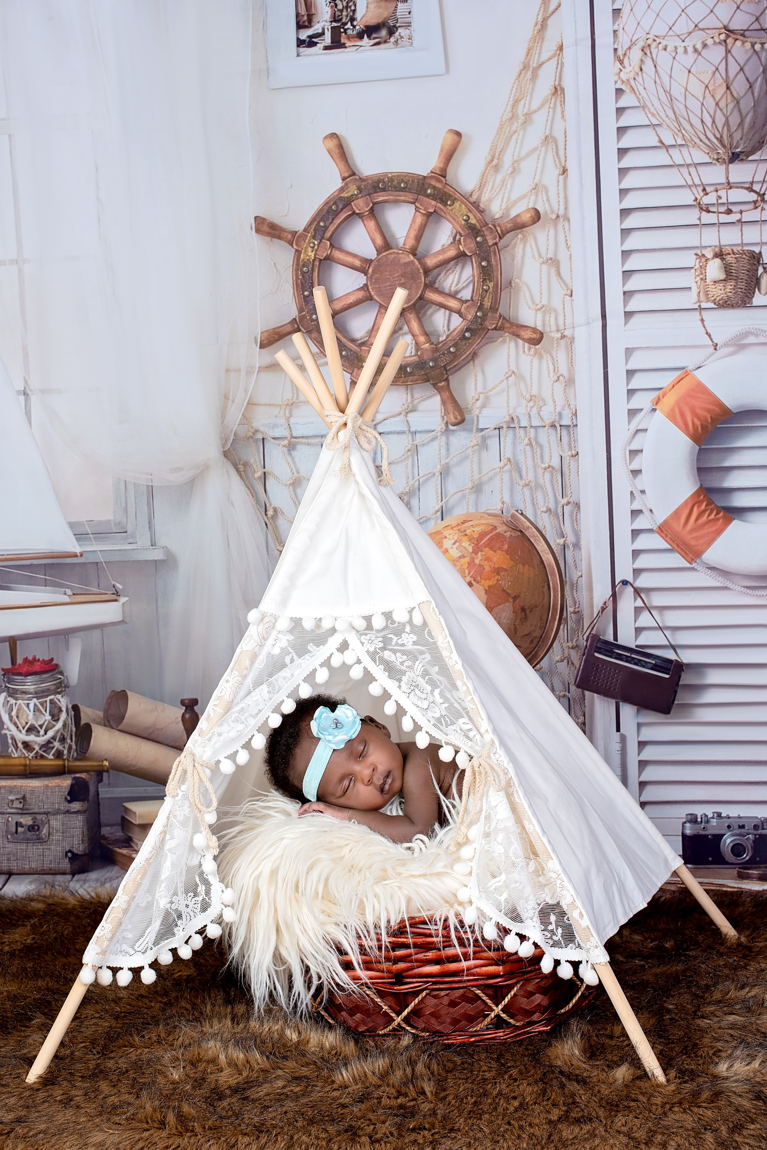 Black baby girl 3 weeks newborn photo shoot laying teepee Mombasa Kenya
