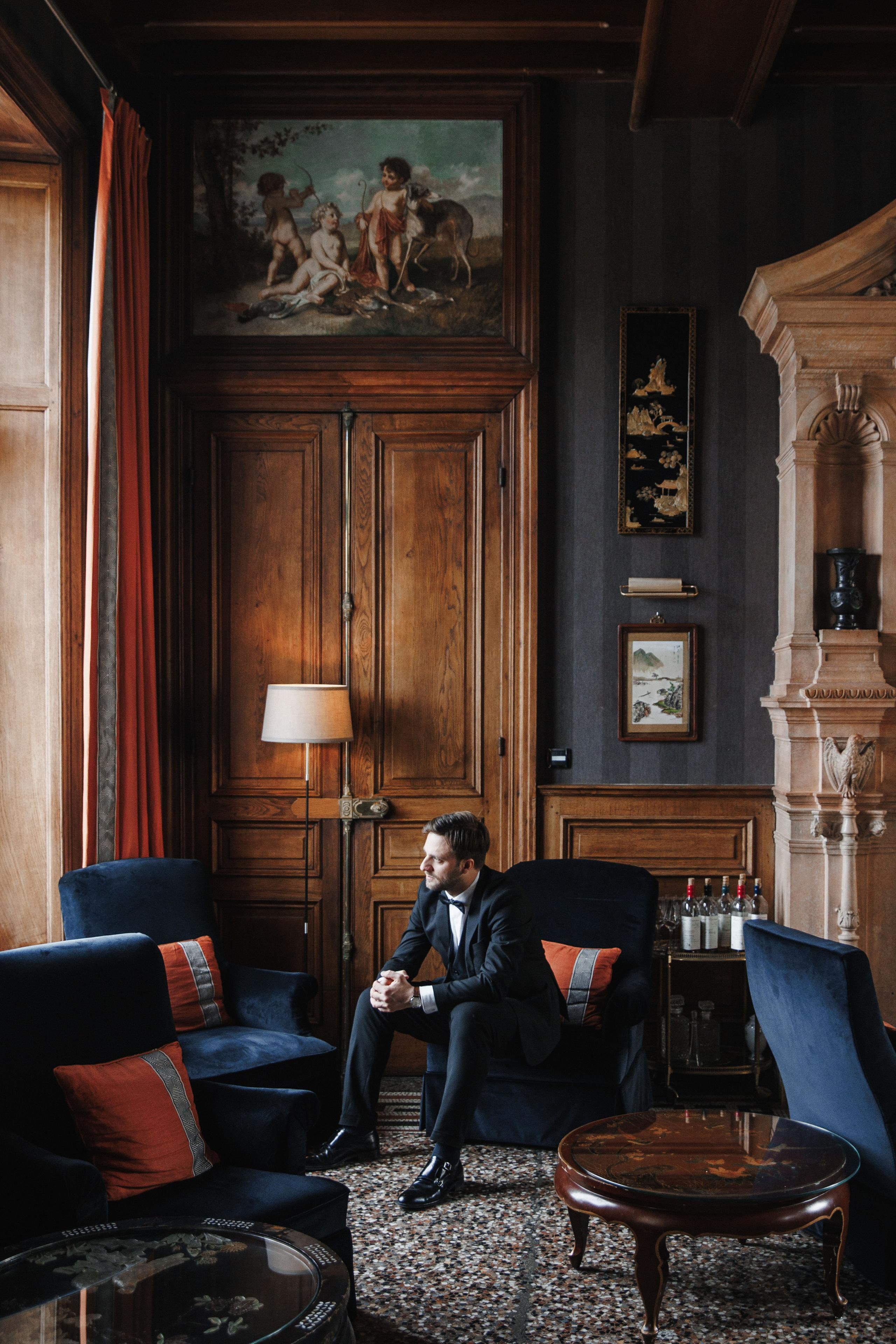 Natural light portrait of the groom smiling warmly, emphasizing his joy on the wedding day in France.
