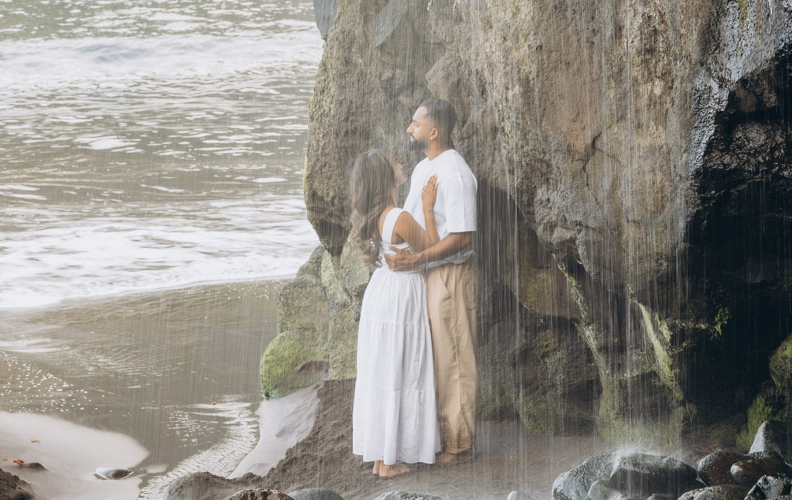 Romantic proposal on Seixal Beach, Madeira — black sand and ocean waves.