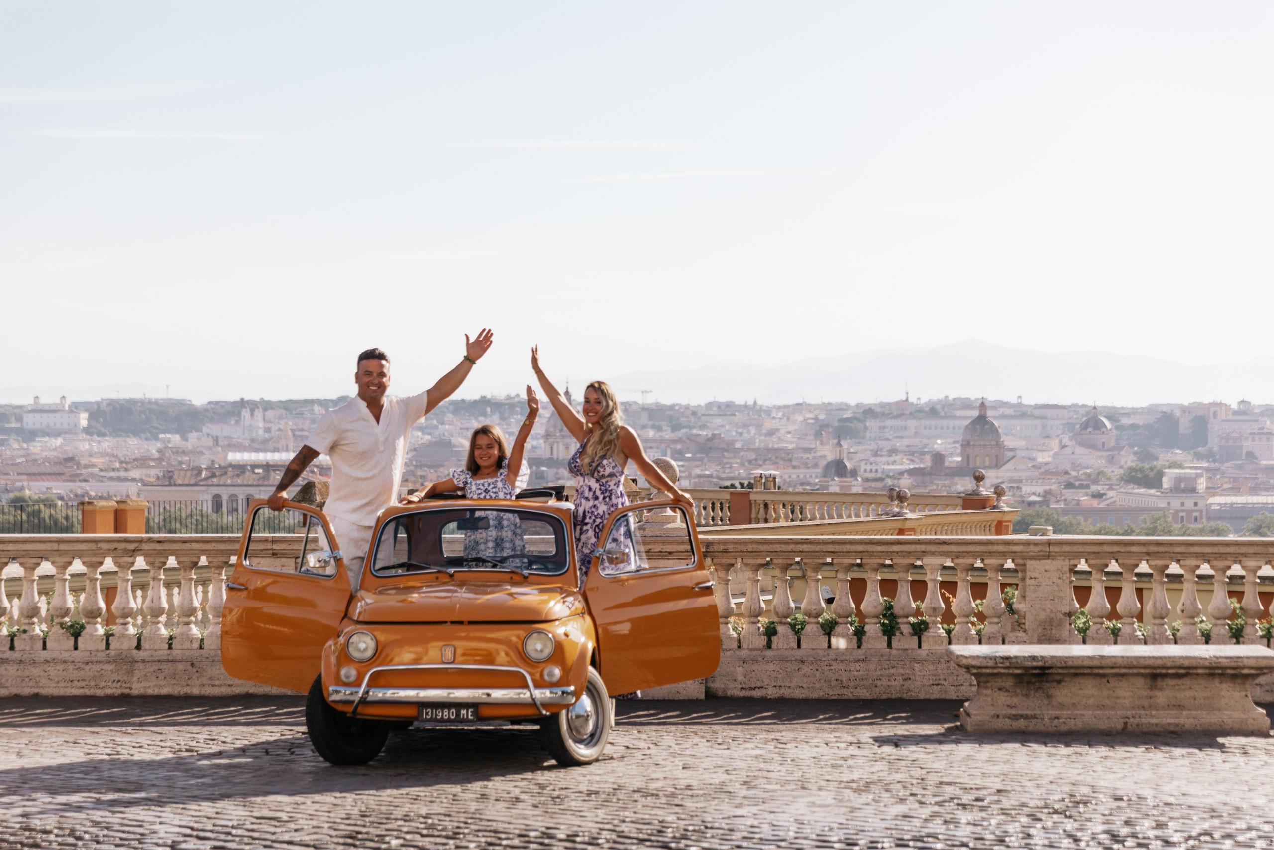 Fiat 500 and Vespa. Photographer in Rome