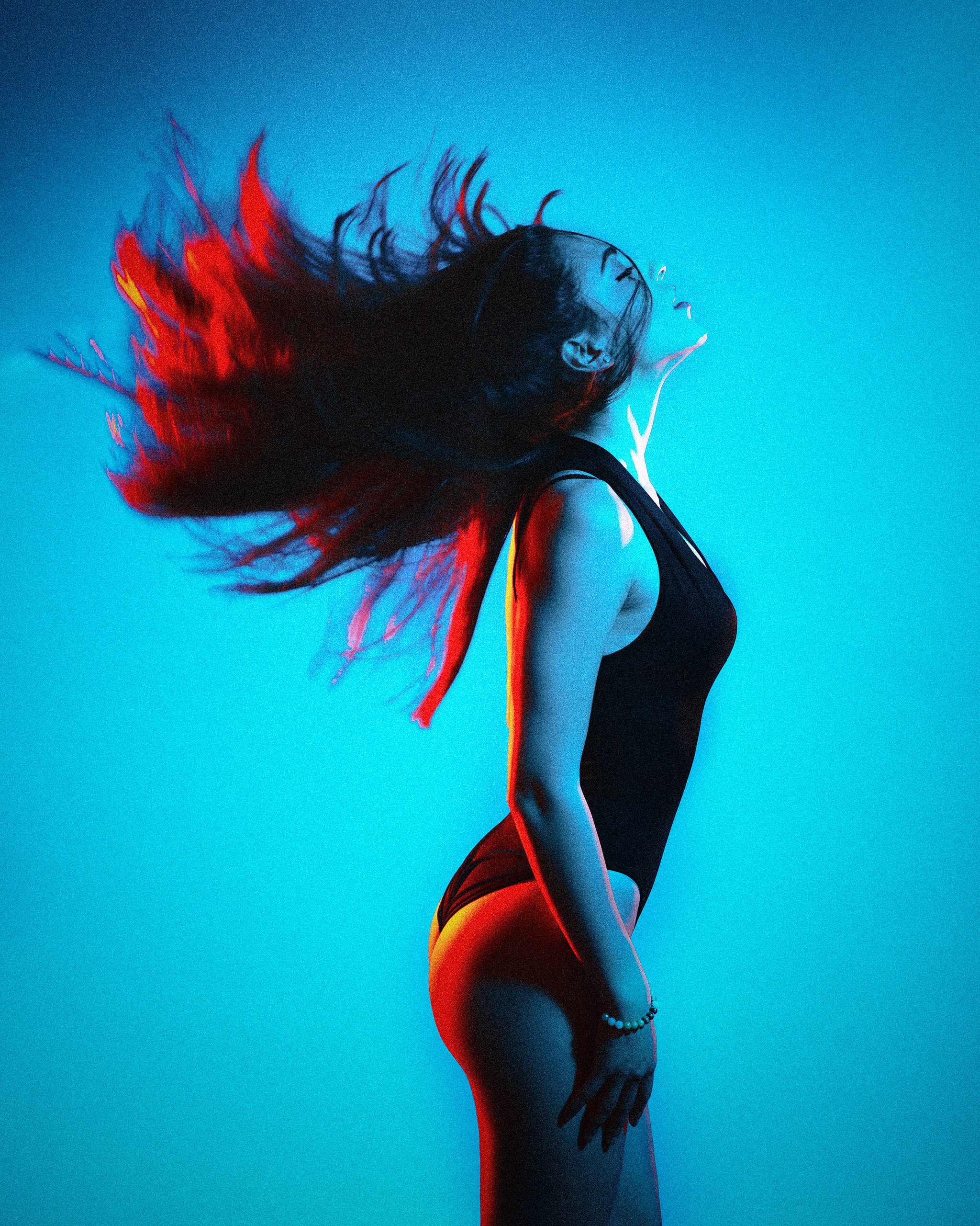 Portrait of a beautiful girl with a sexy body in underwear in a photo studio, on a blue background, using pink and blue gel filters, Dimitri Ilkov, photographer Edmonton