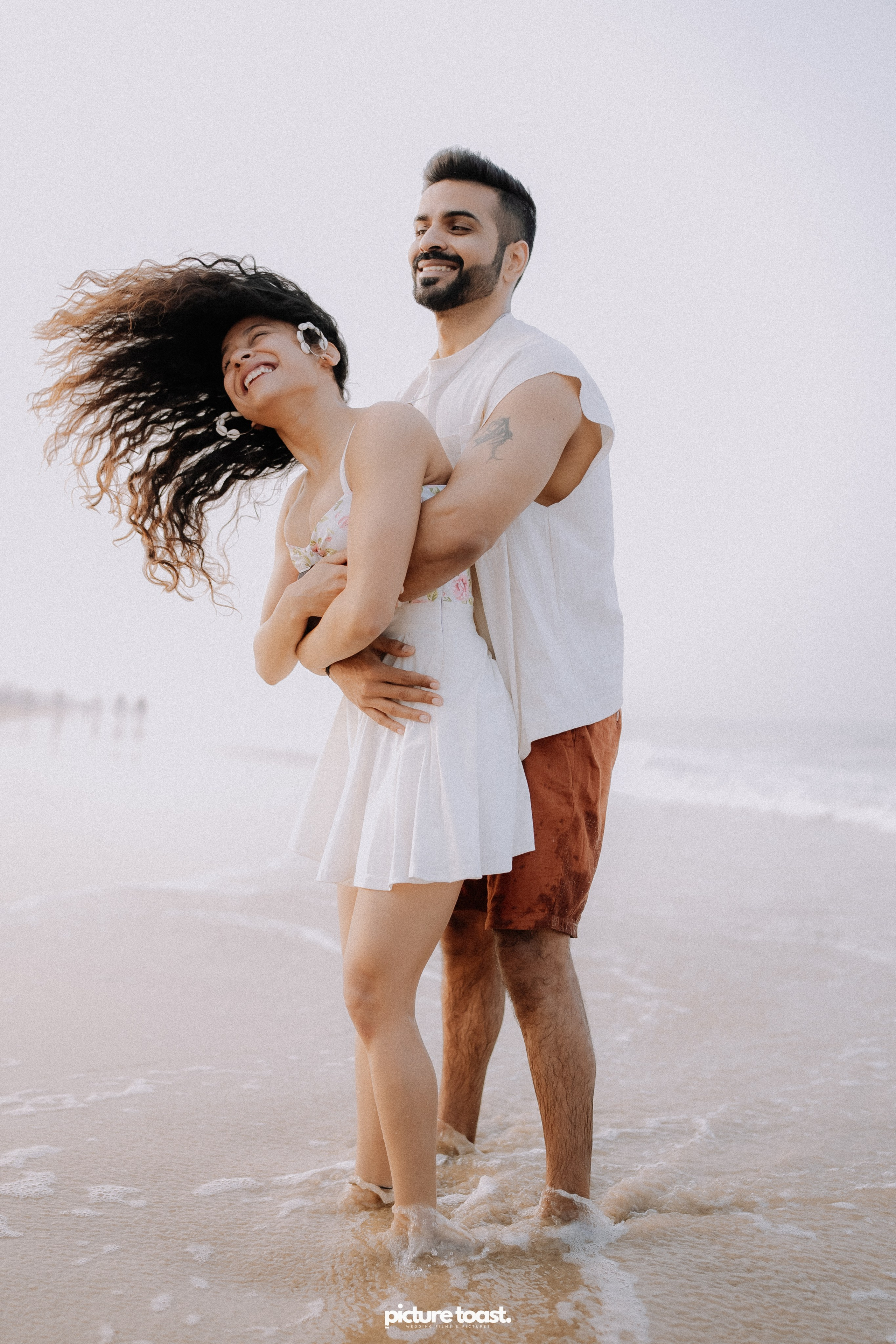 Love In The Beach. Fine art Wedding Photographers in India & Canada