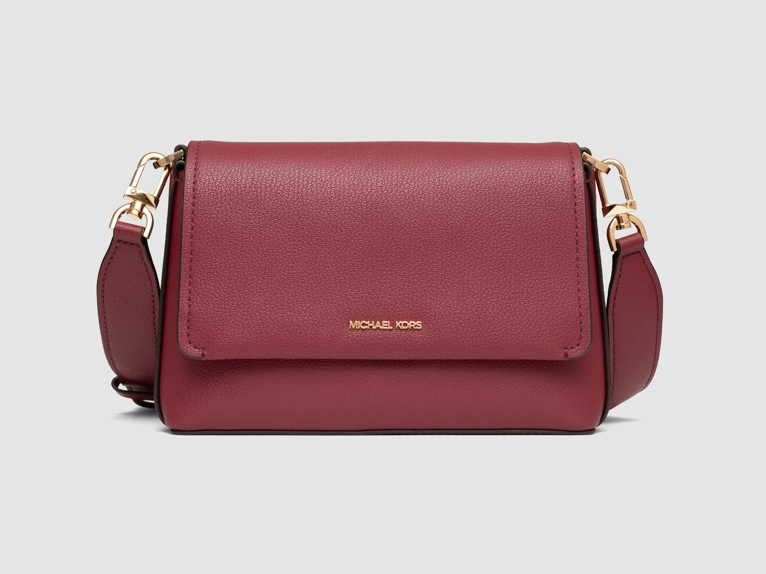 Burgundy leather crossbody bag white background fashion accessories photography