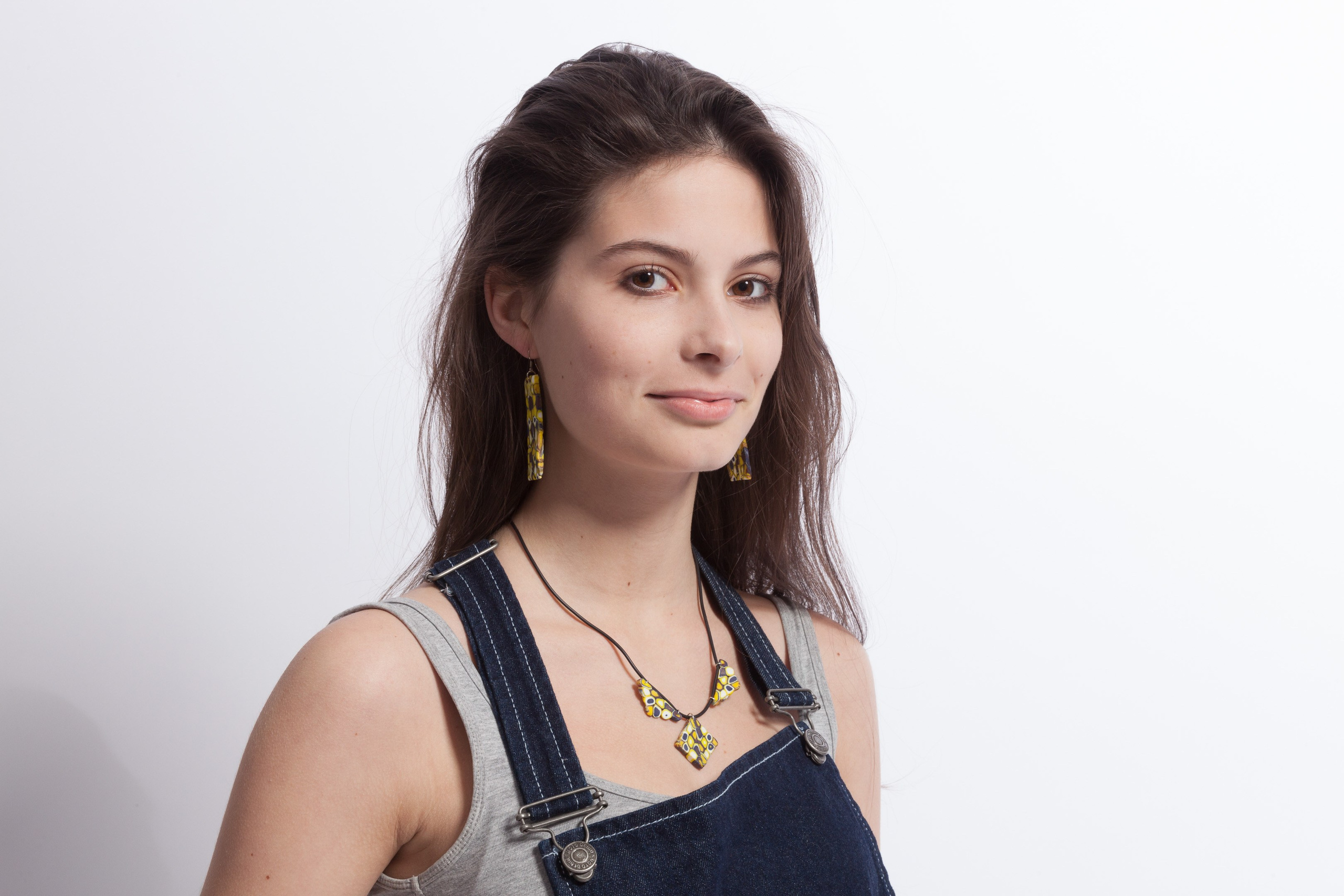 Portrait of a young girl on white studio background - photographer Andrey Dunin
