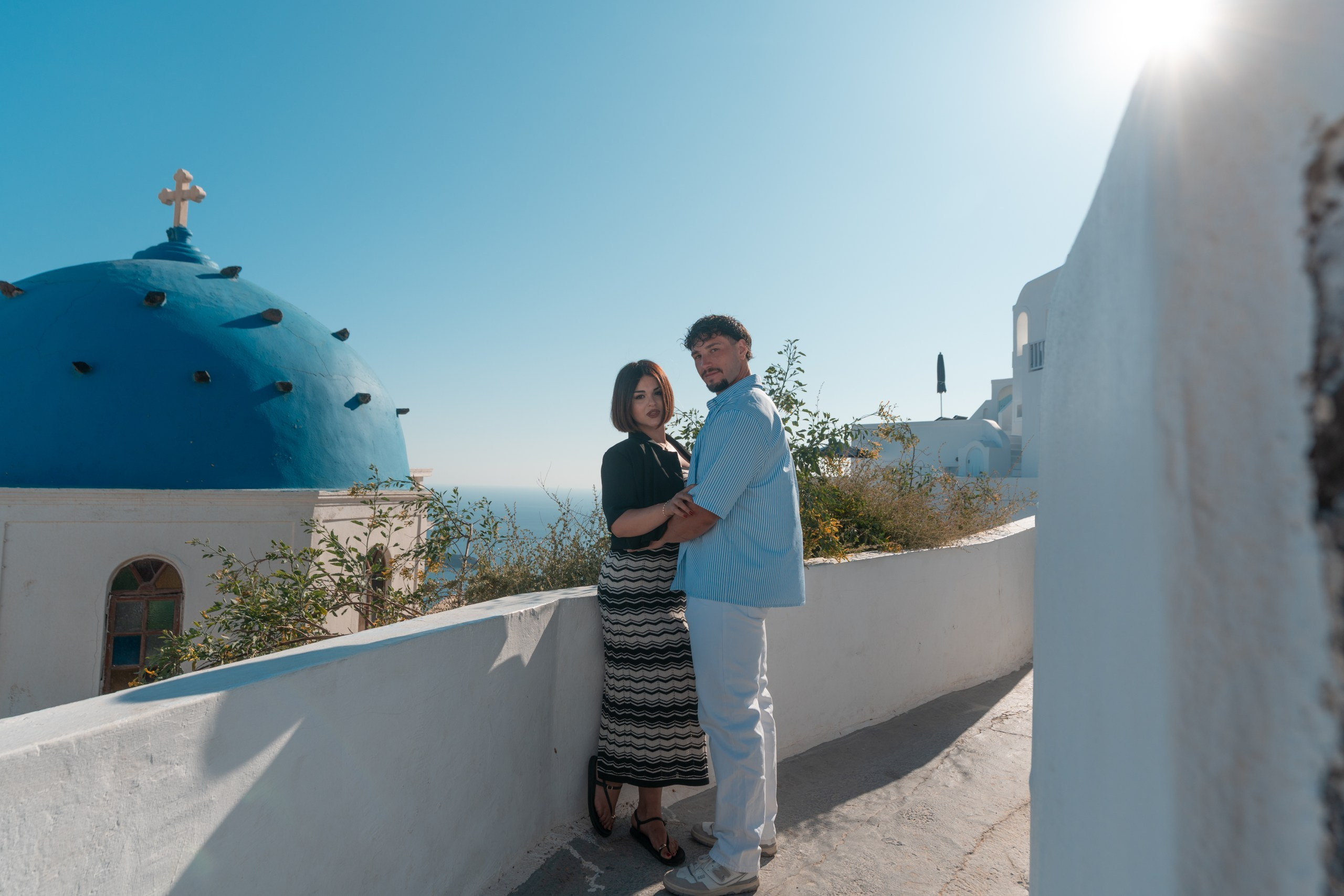 Discover the magic of a romantic stroll through Imerovigli, Santorini, with Sokolove Alex! Explore 43 stunning photos capturing love, adventure, and breathtaking views of the Aegean Sea. Wander hand-in-hand along cobblestone paths, admire iconic blue-domed churches, and soak in the golden-hour beauty of white-washed cliffs and vibrant bougainvillea. This couple’s journey highlights intimate moments, scenic overlooks, and the timeless charm of Santorini’s hidden gem.