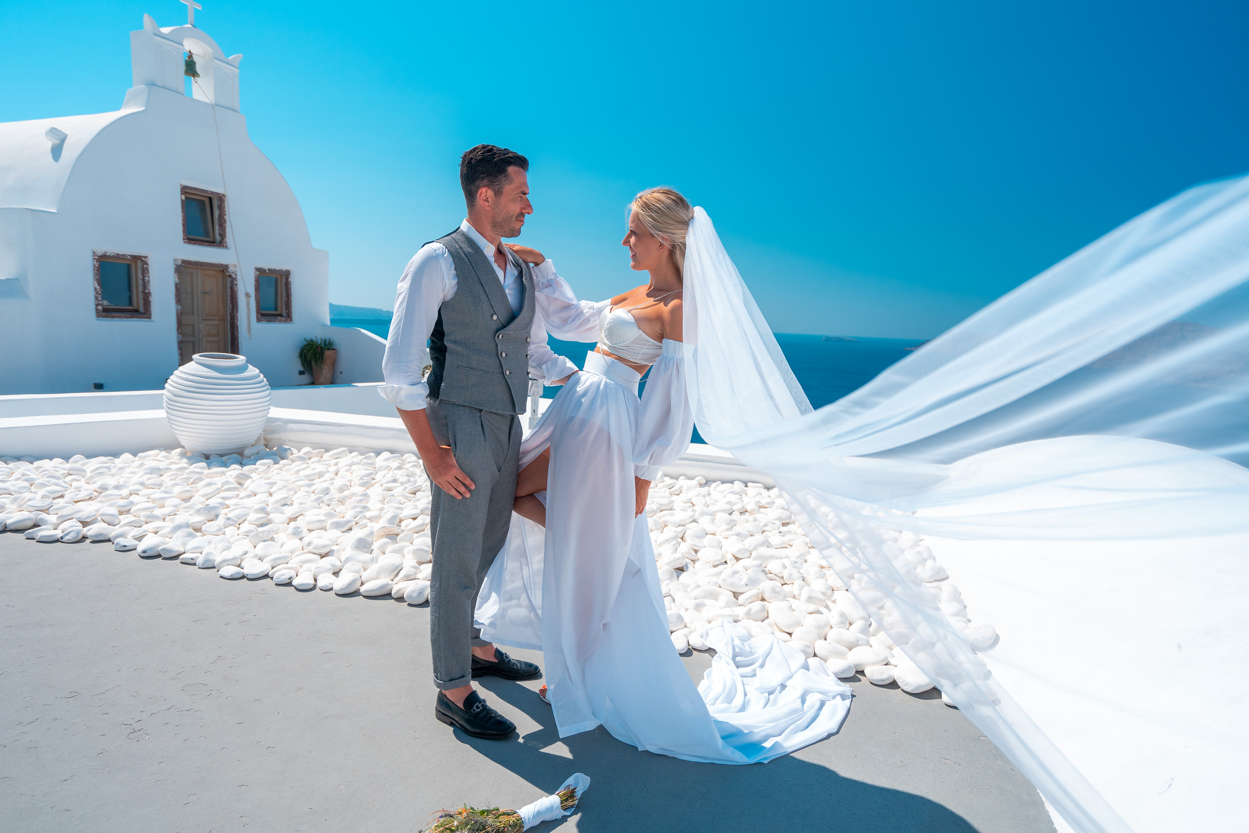 Wedding photographer in Santorini. Photographer in Santorini SokoLOVE Alex| Flying Dress Santorini