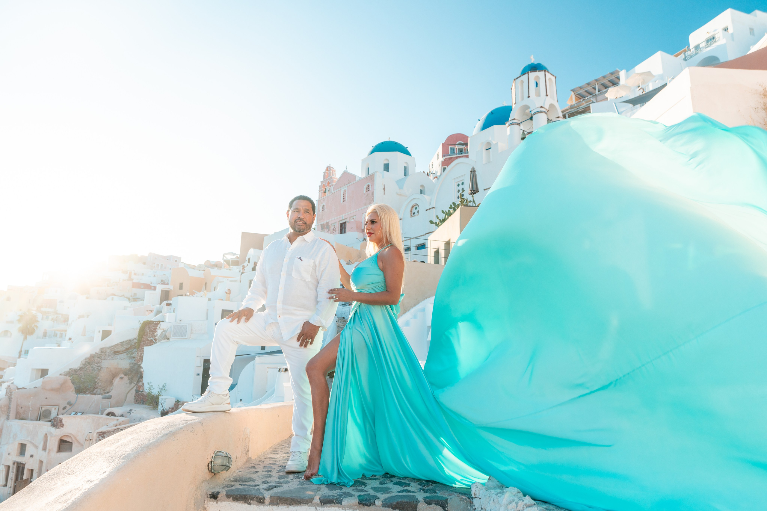 Capture timeless beauty in Santorini with the elegant Tiffany flying dress by Sokolove. Featuring a chic bare-back design, it fits one sizes  and is perfect for creating stunning, flowing photos against the island’s iconic backdrop