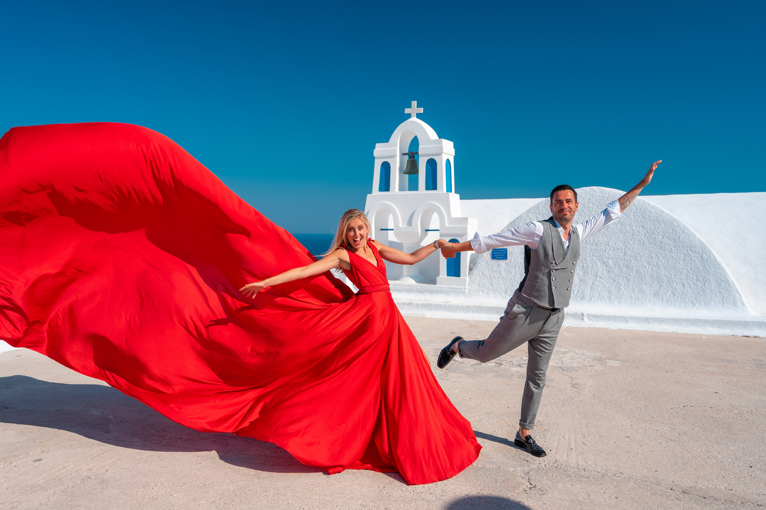 Wedding photographer in Santorini. Photographer in Santorini SokoLOVE Alex| Flying Dress Santorini