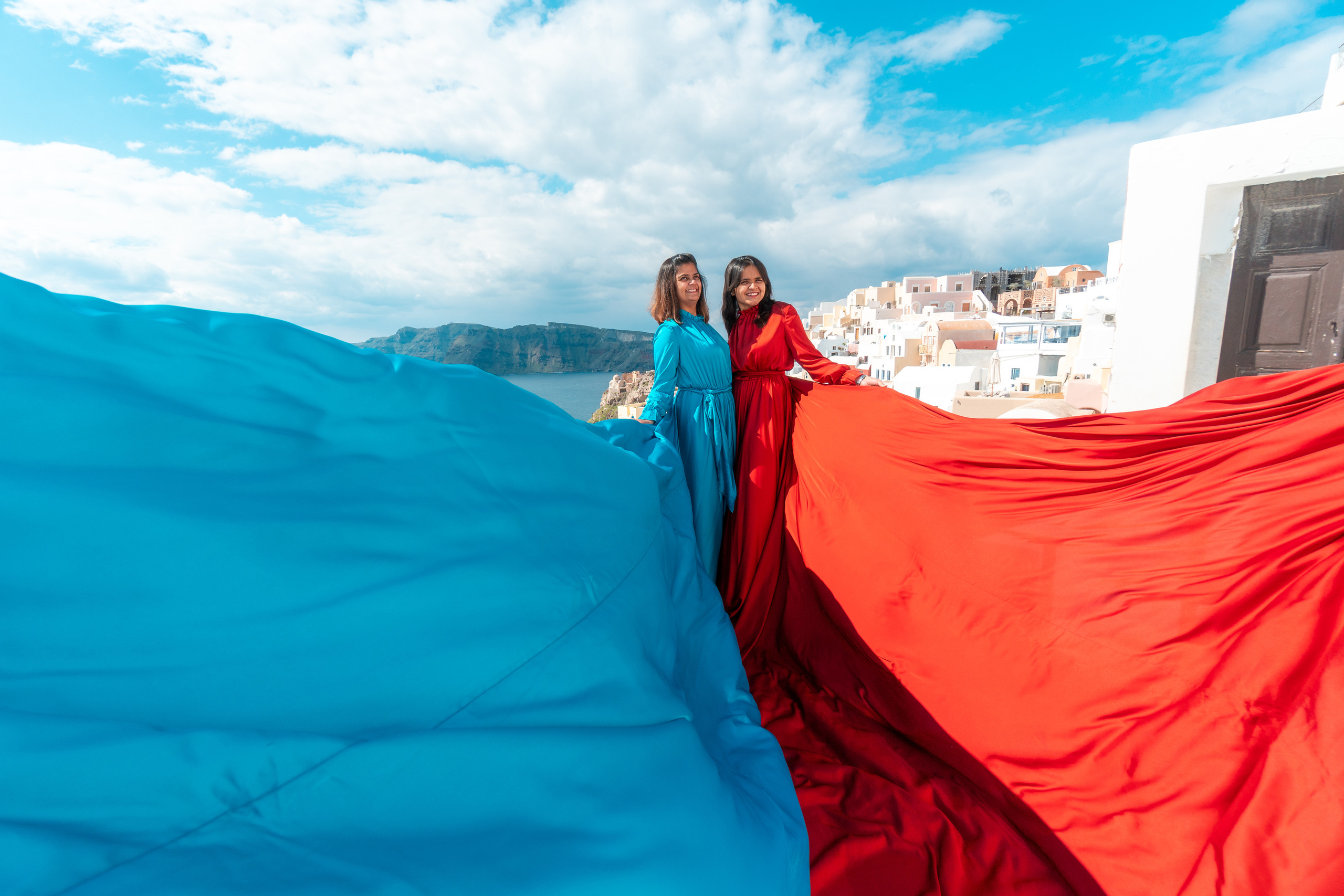 Red Long Sleeve Flying Dress Rent in Santorini. Photographer in Santorini SokoLOVE Alex| Flying Dress Santorini