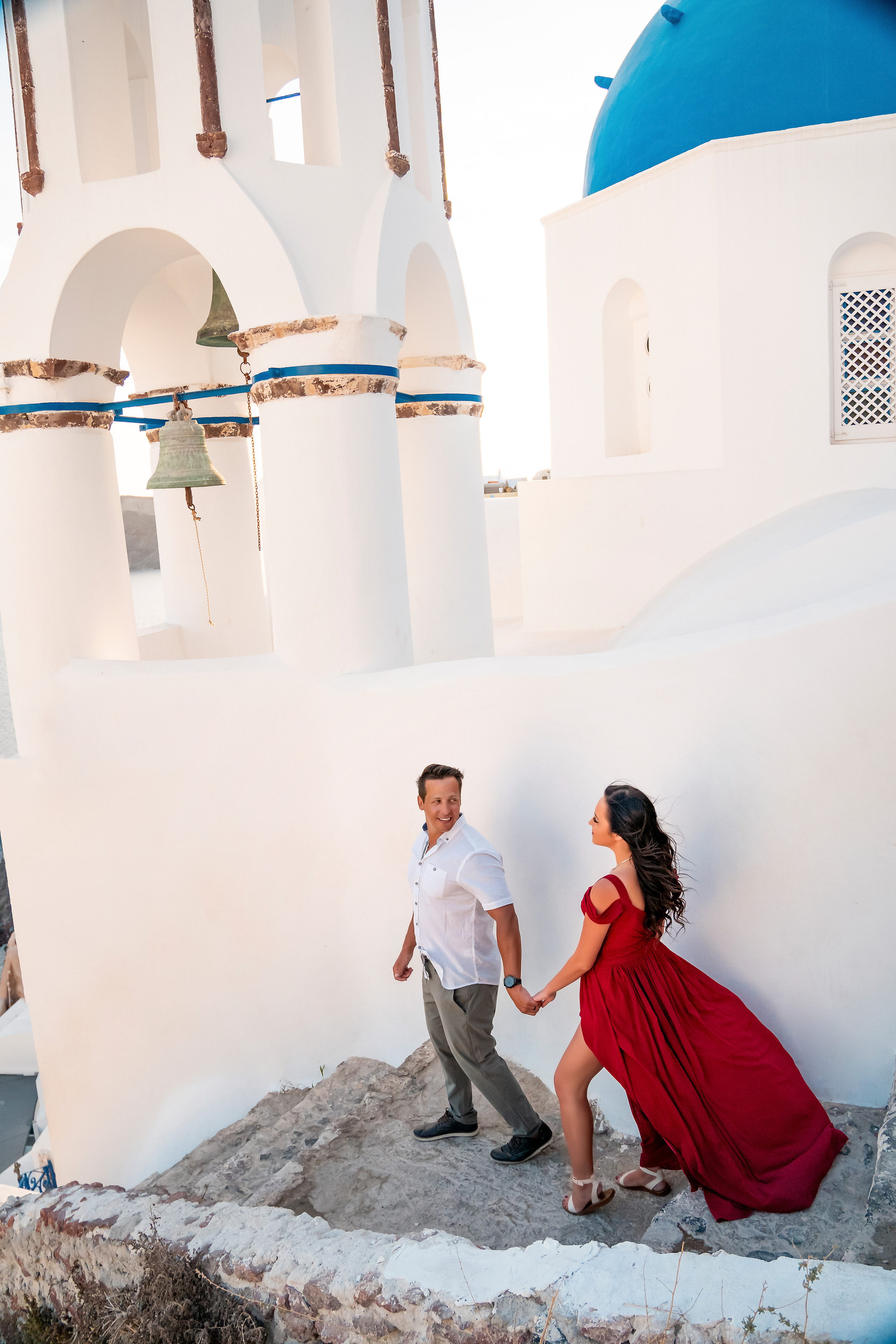 Couple photo session in Santorini, Oia. Photographer in Santorini SokoLOVE Alex| Flying Dress Santorini