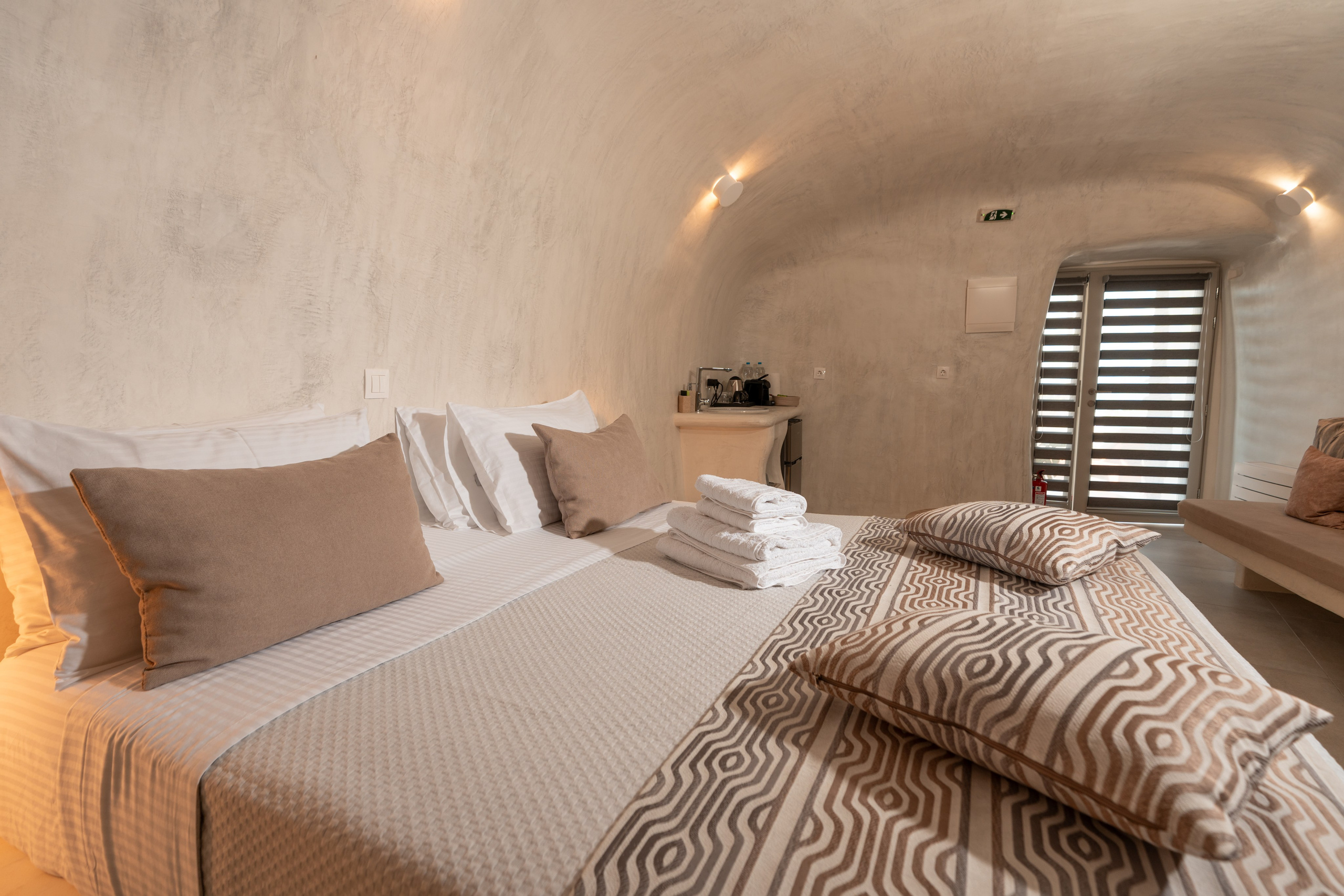 Hotel caves in Oia. Flying Dress Santorini Photographer | SokoLOVE — Book 2026