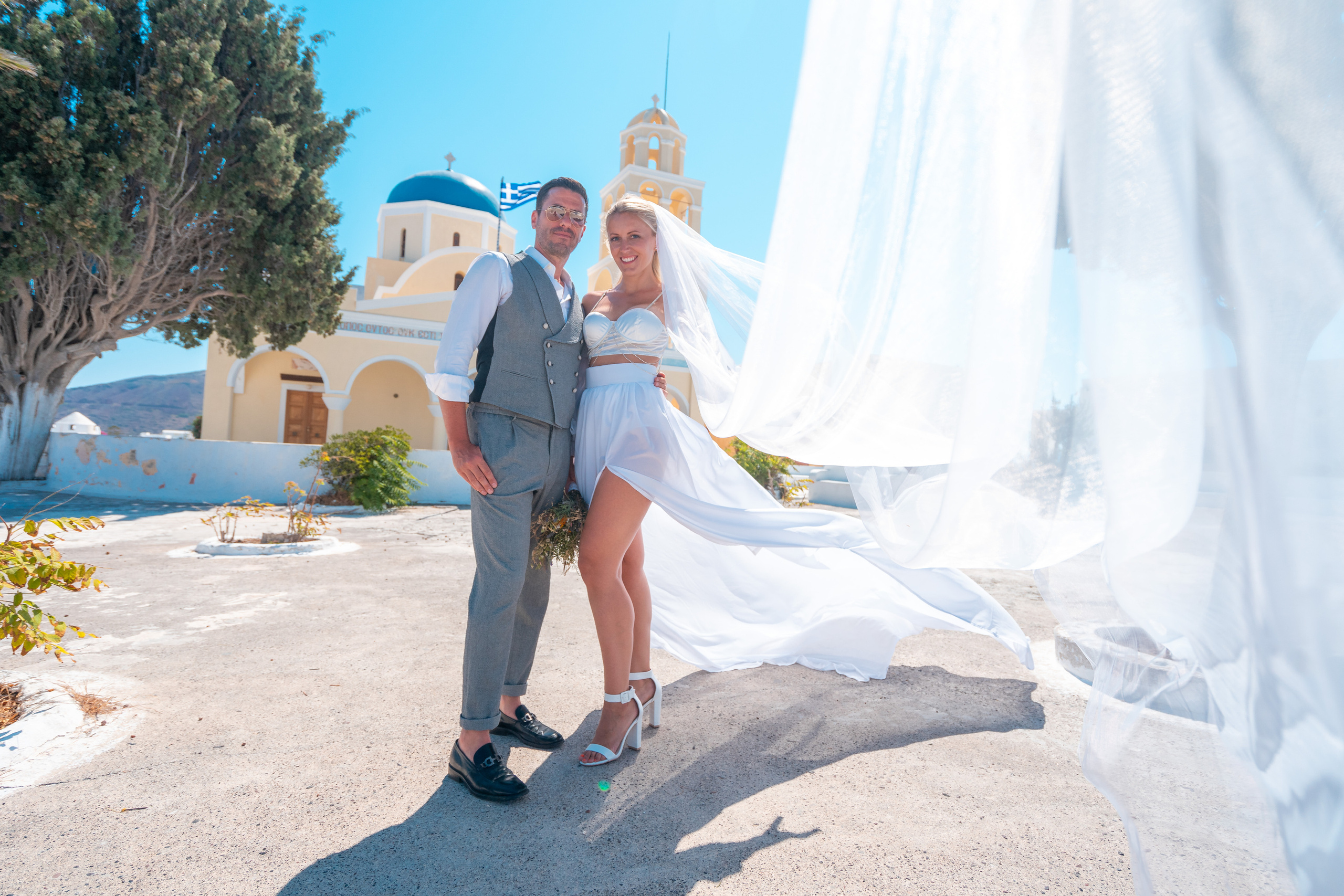 Wedding photographer in Santorini. Photographer in Santorini SokoLOVE Alex| Flying Dress Santorini
