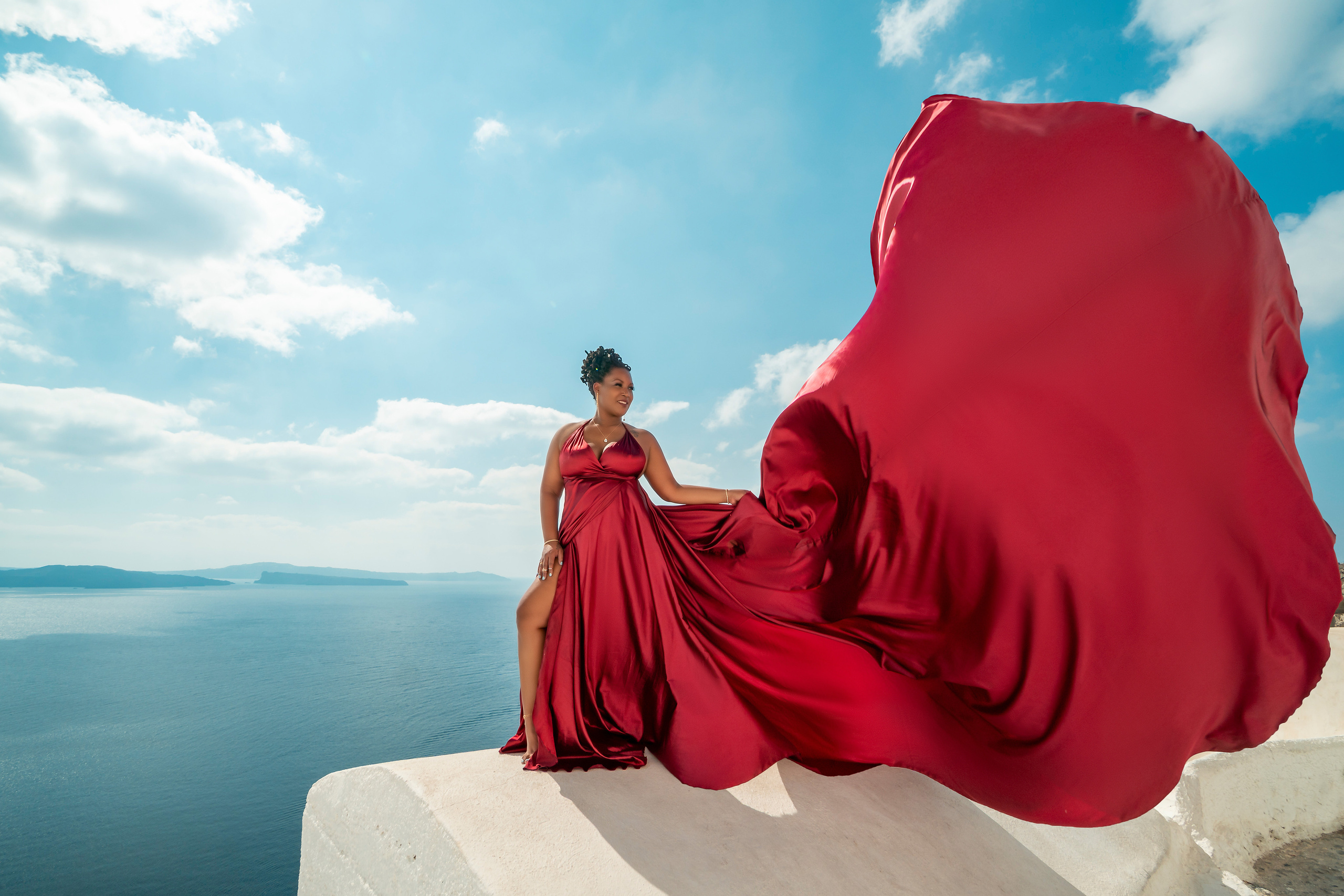 Rent a Plus Size Red Wine Satin Flying Dress in Santorini – Sizes L-XXXL with V-shaped Back"Looking for a plus size flying dress in Santorini? Rent this stunning red wine satin dress with a V-shaped back, available in L-XXXL sizes. Perfect for couples, family photoshoots, or a solo session, this dress will add elegance and drama to your Santorini photos."